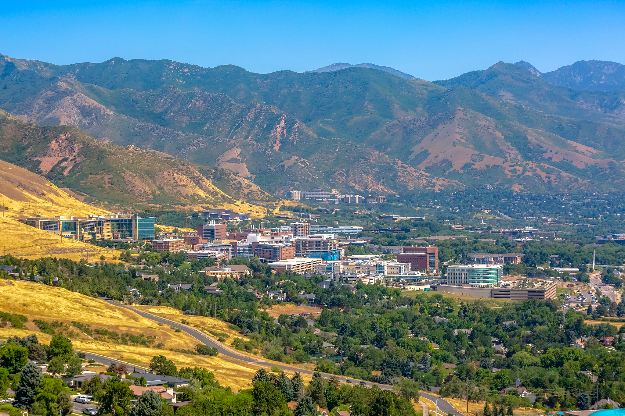 high angle view of buildings and mountains against sky