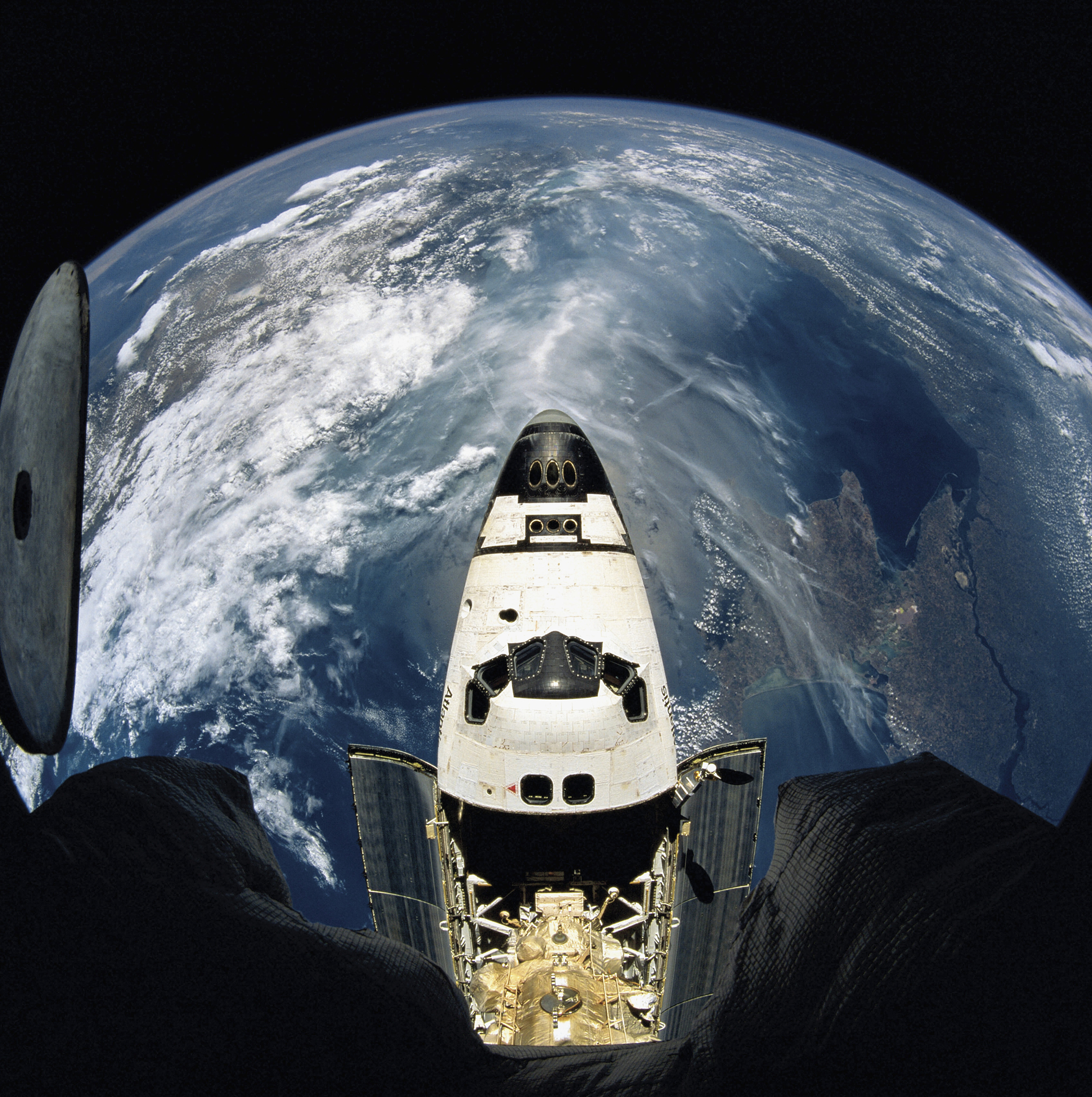 elevated view of a spacecraft orbiting over the earth