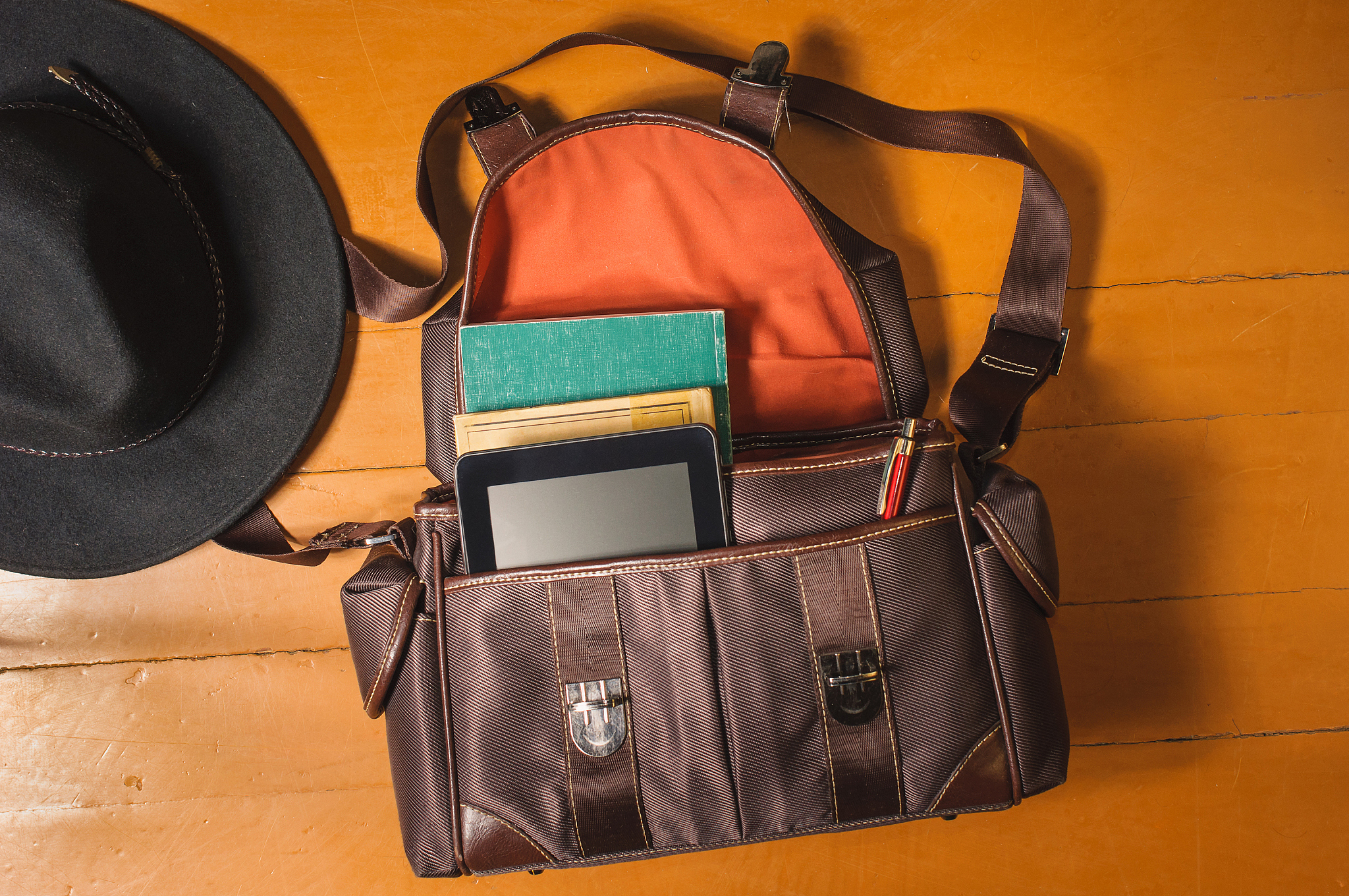 vintage bag and hat on wood floor