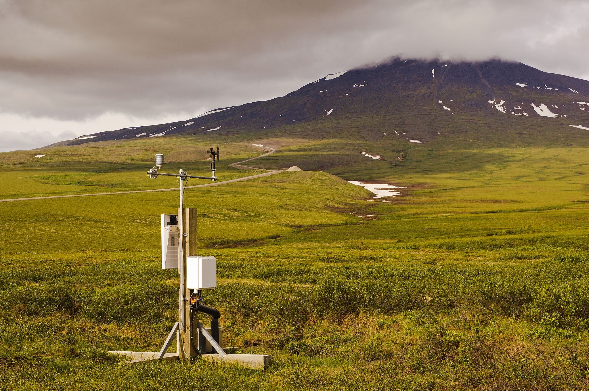 a weather monitor station sits in the tundra