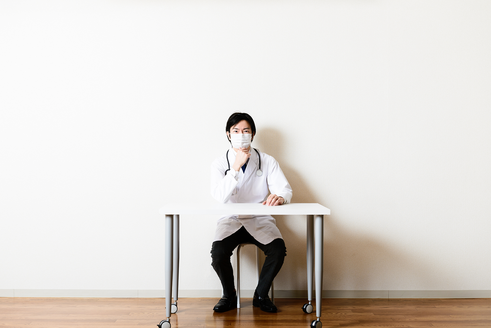 asian doctor in room