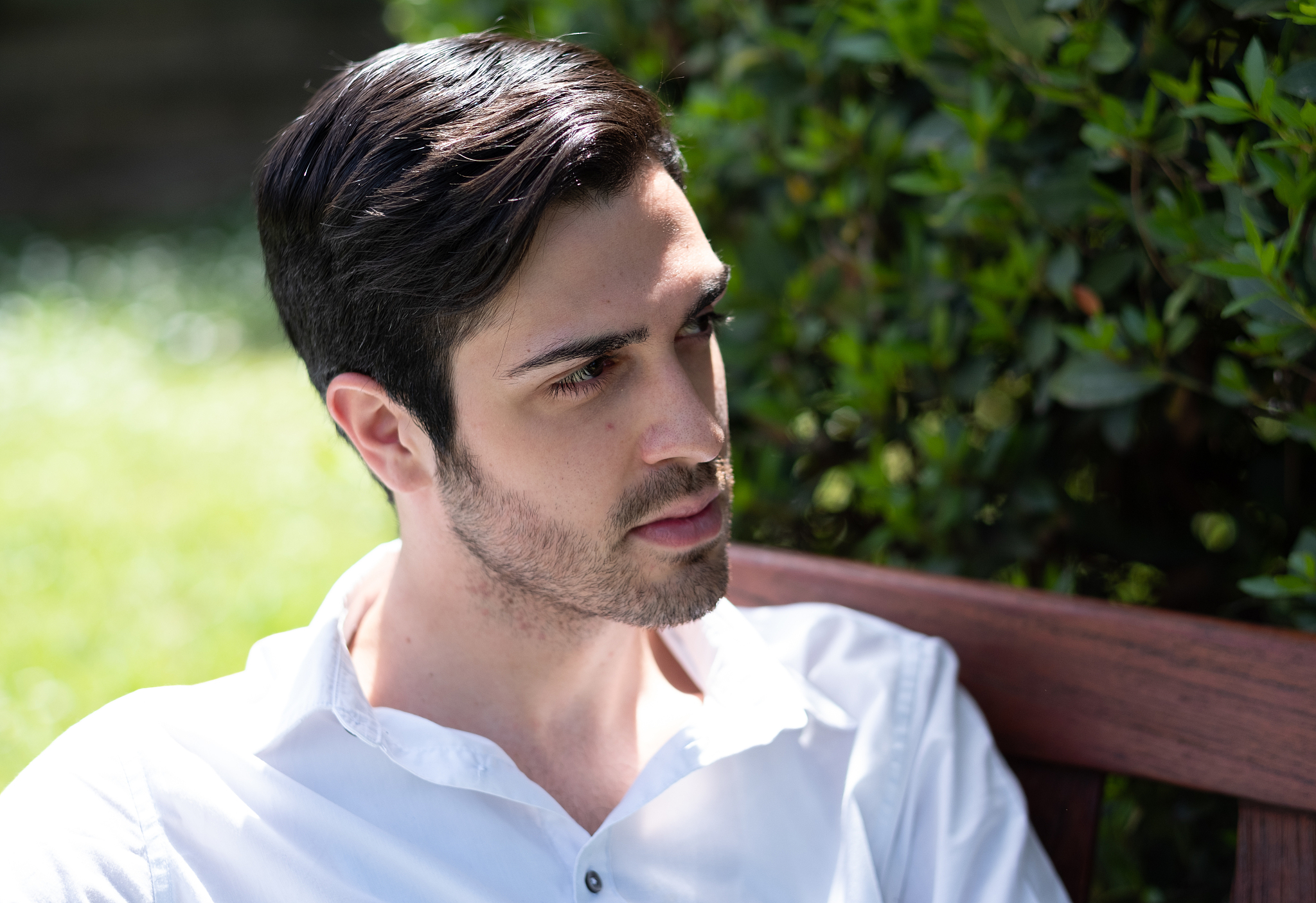 close-up of man sitting outdoors