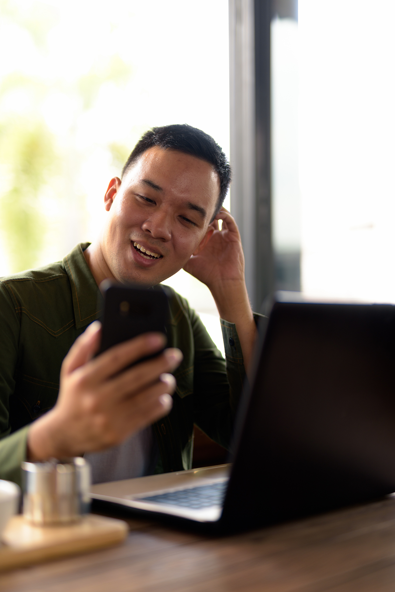portrait of young asian man in coffee shop