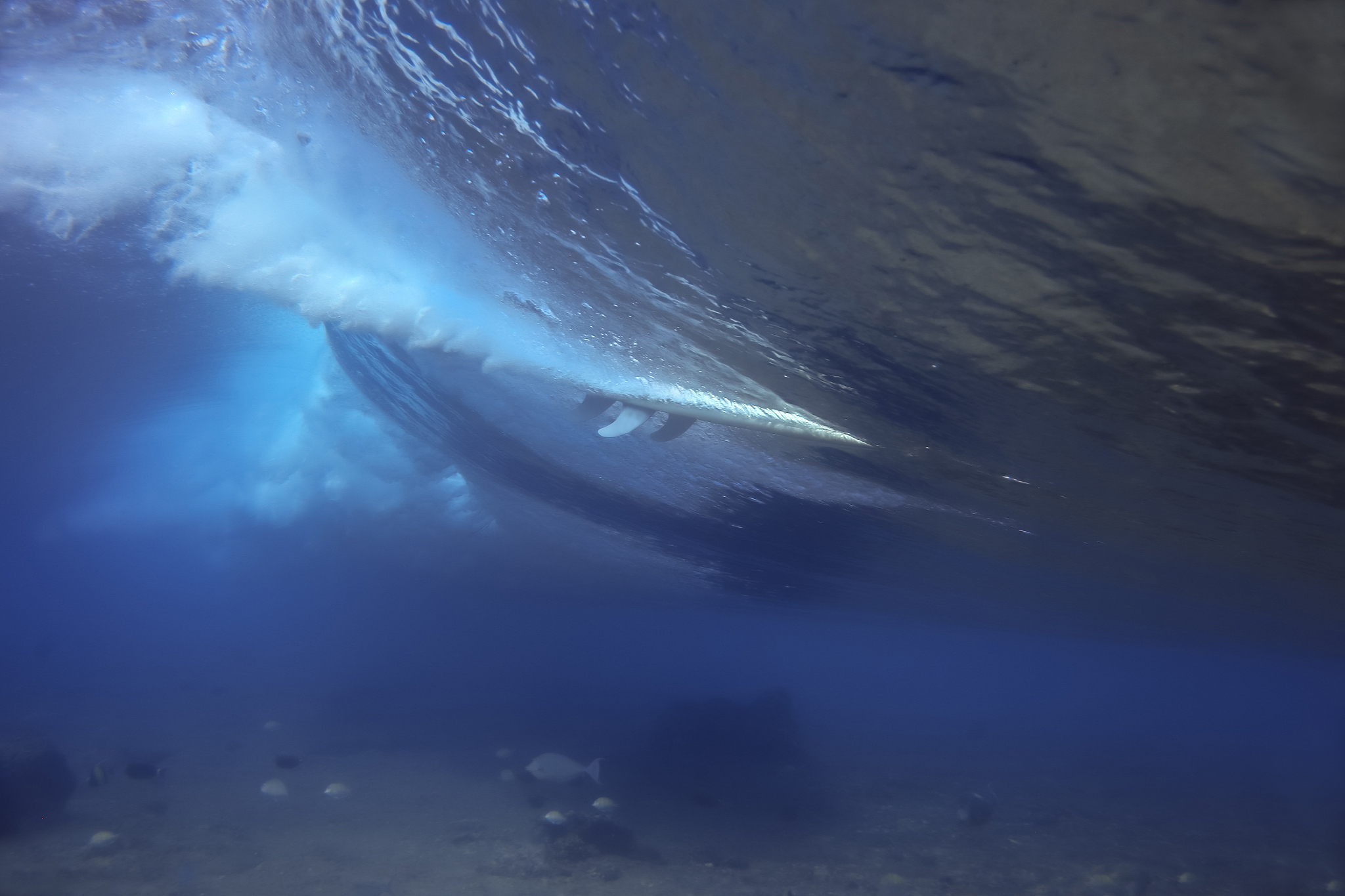 surfboard underwater in sea