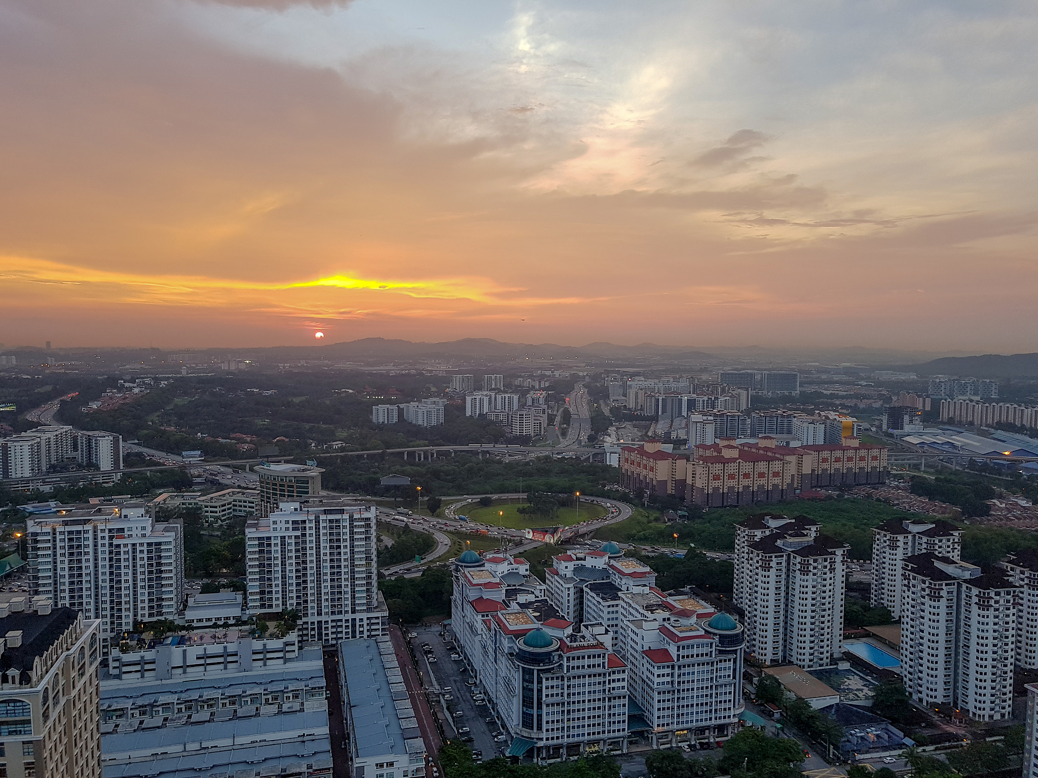 high angle view of buildings against sky during sunset