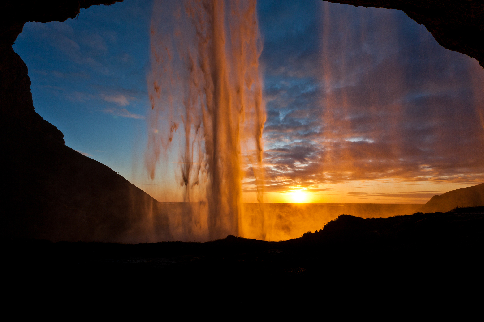 behind the waterfall