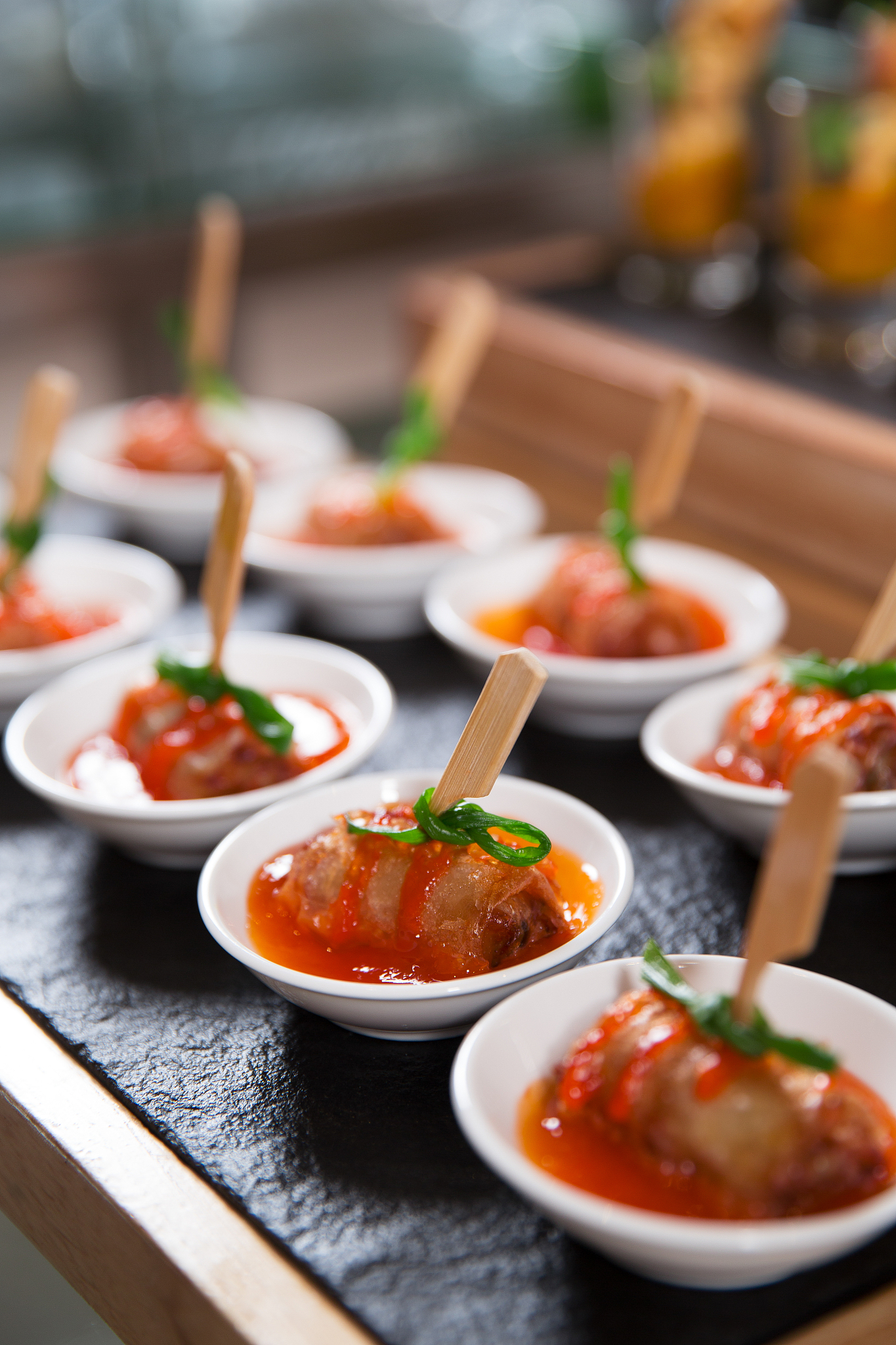 delicious meat rolls with sauce on small plates