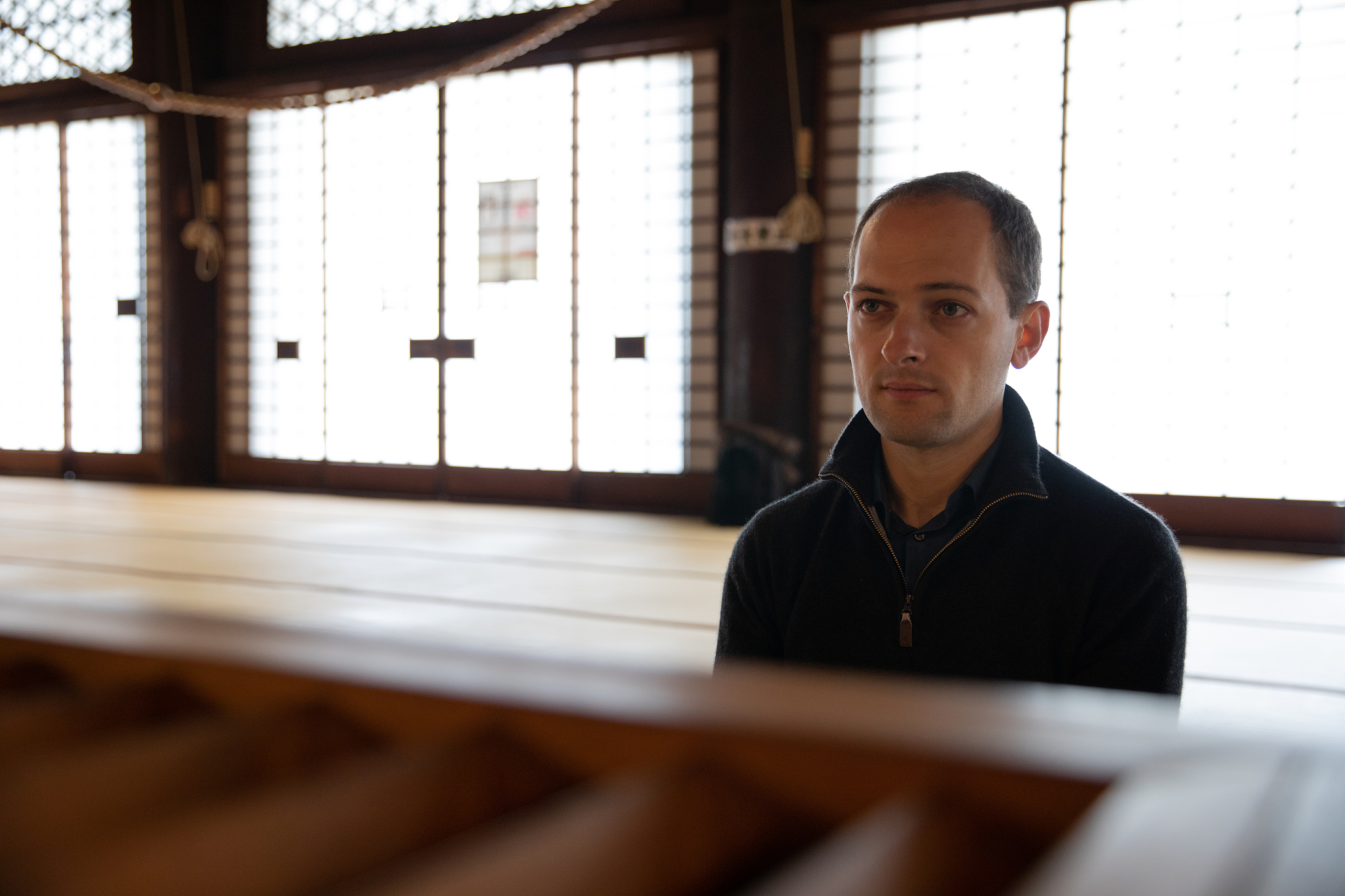 caucasian man meditating in temple
