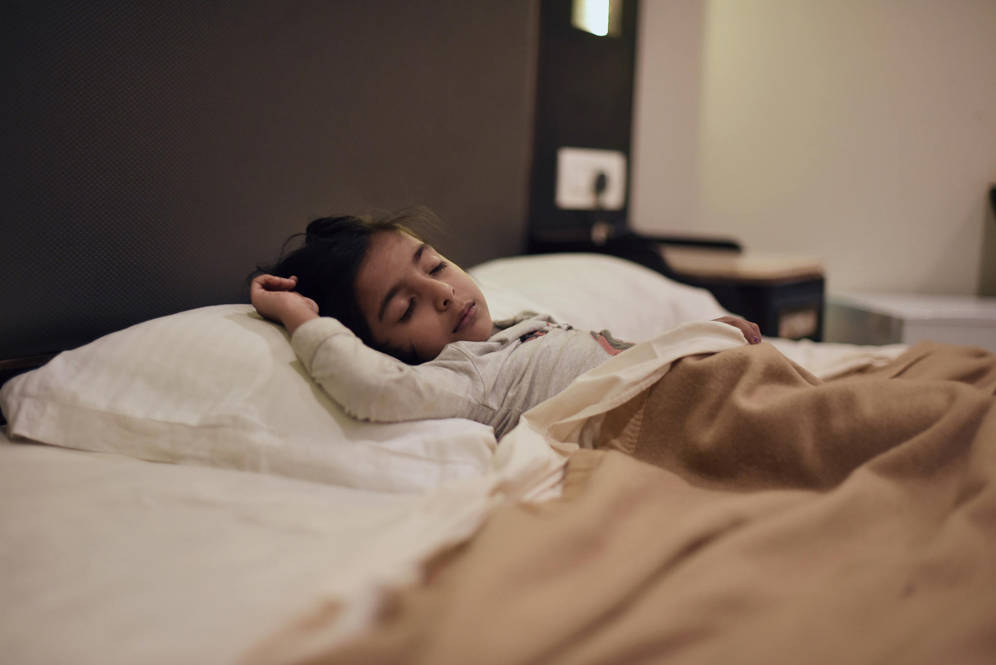 young girl sleeping in the bed