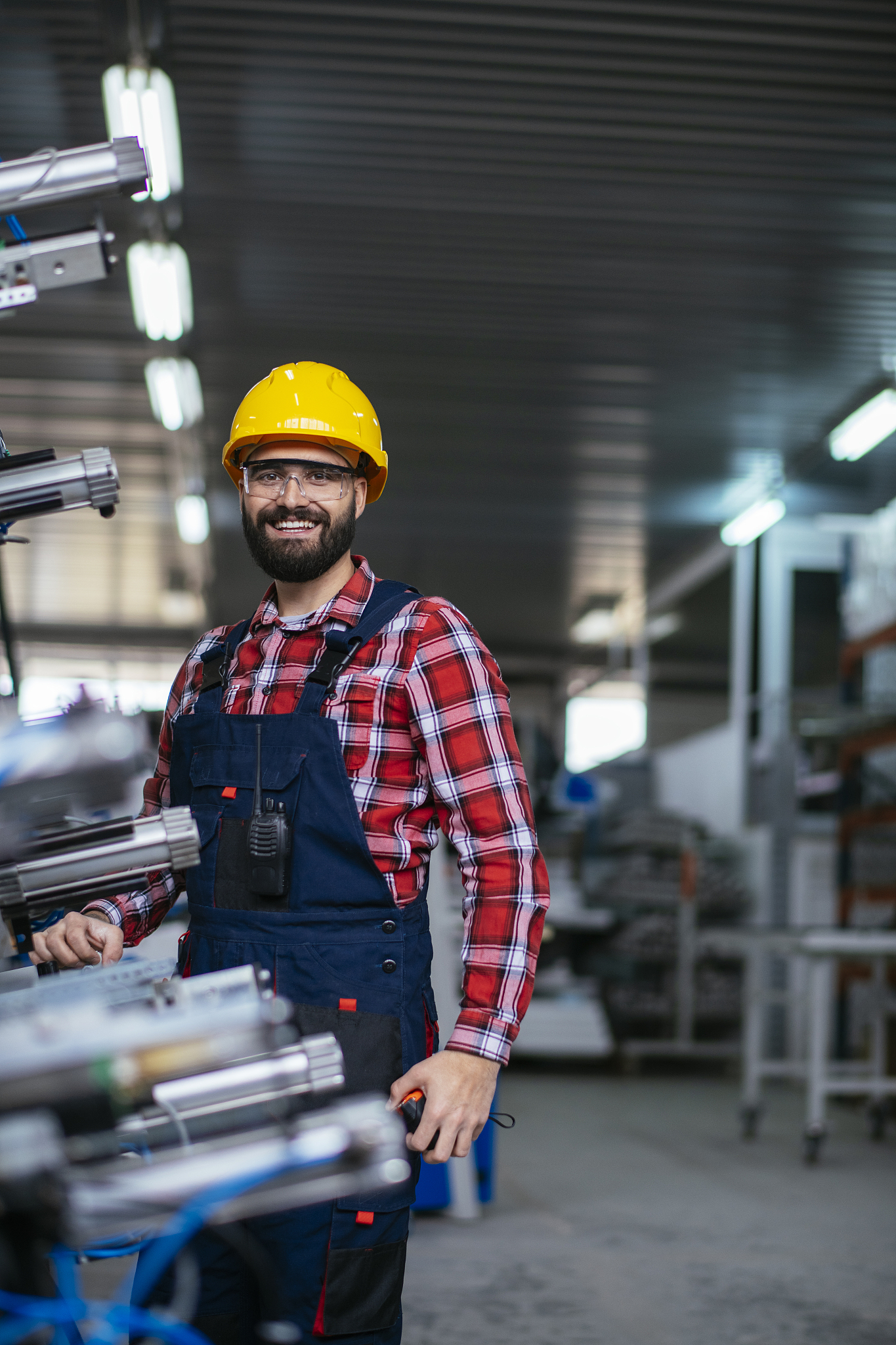 worker in factory on machine