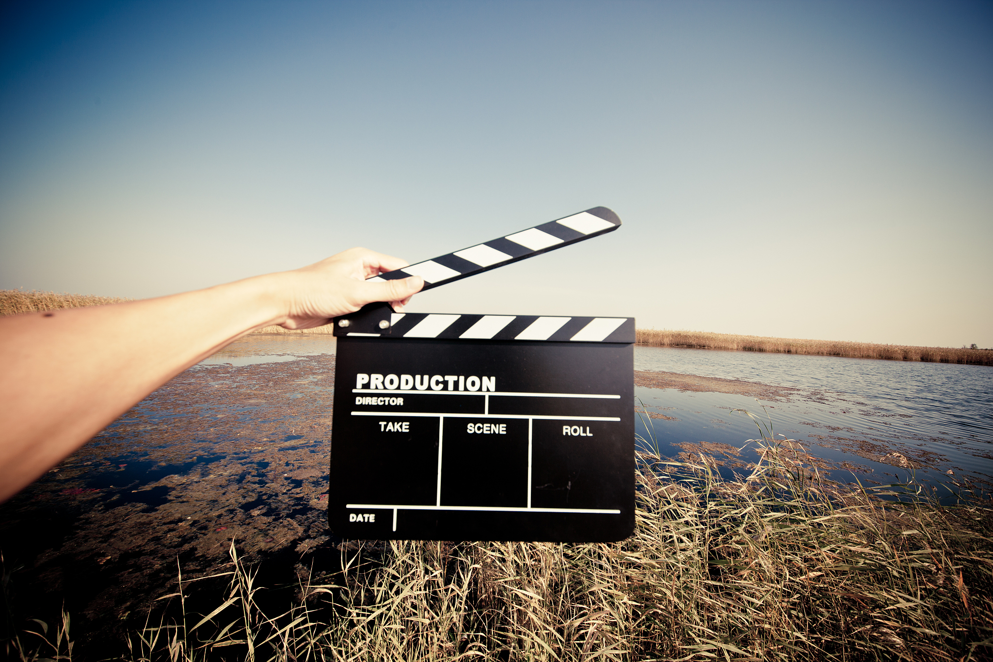 hands holding a movie clapboard