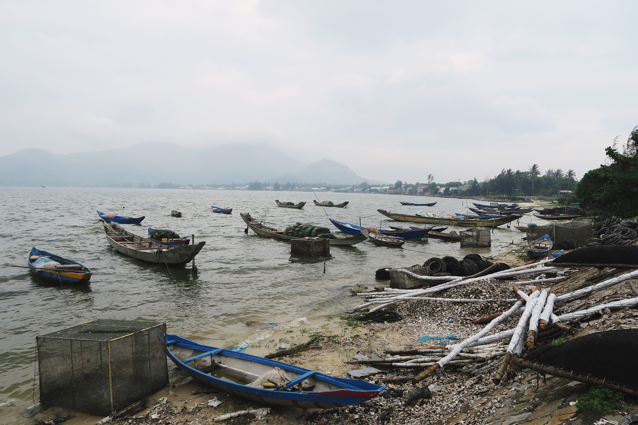 boats moored on sea against sky