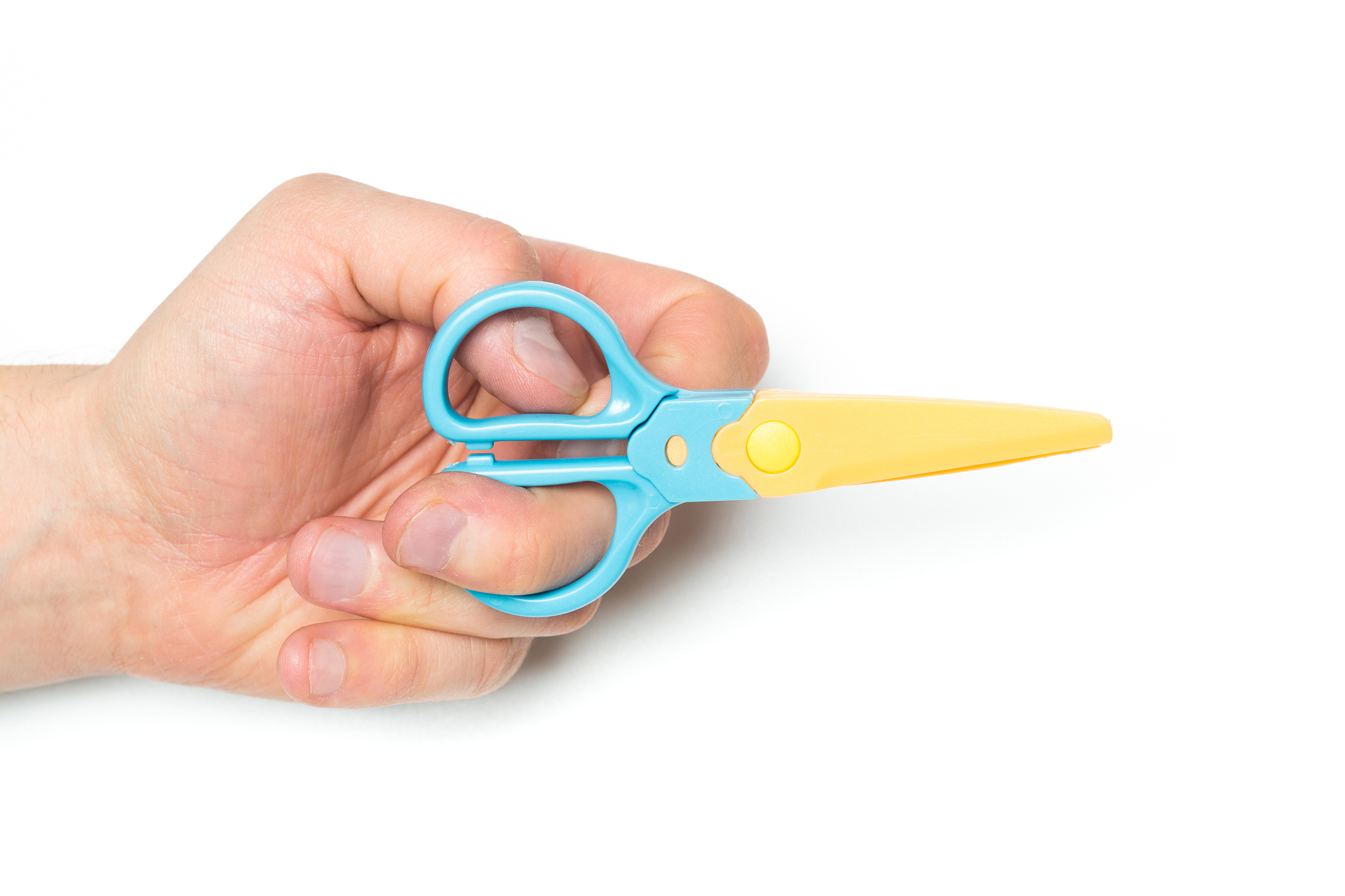 men's hand holding safety scissors on isolated backgroung, close