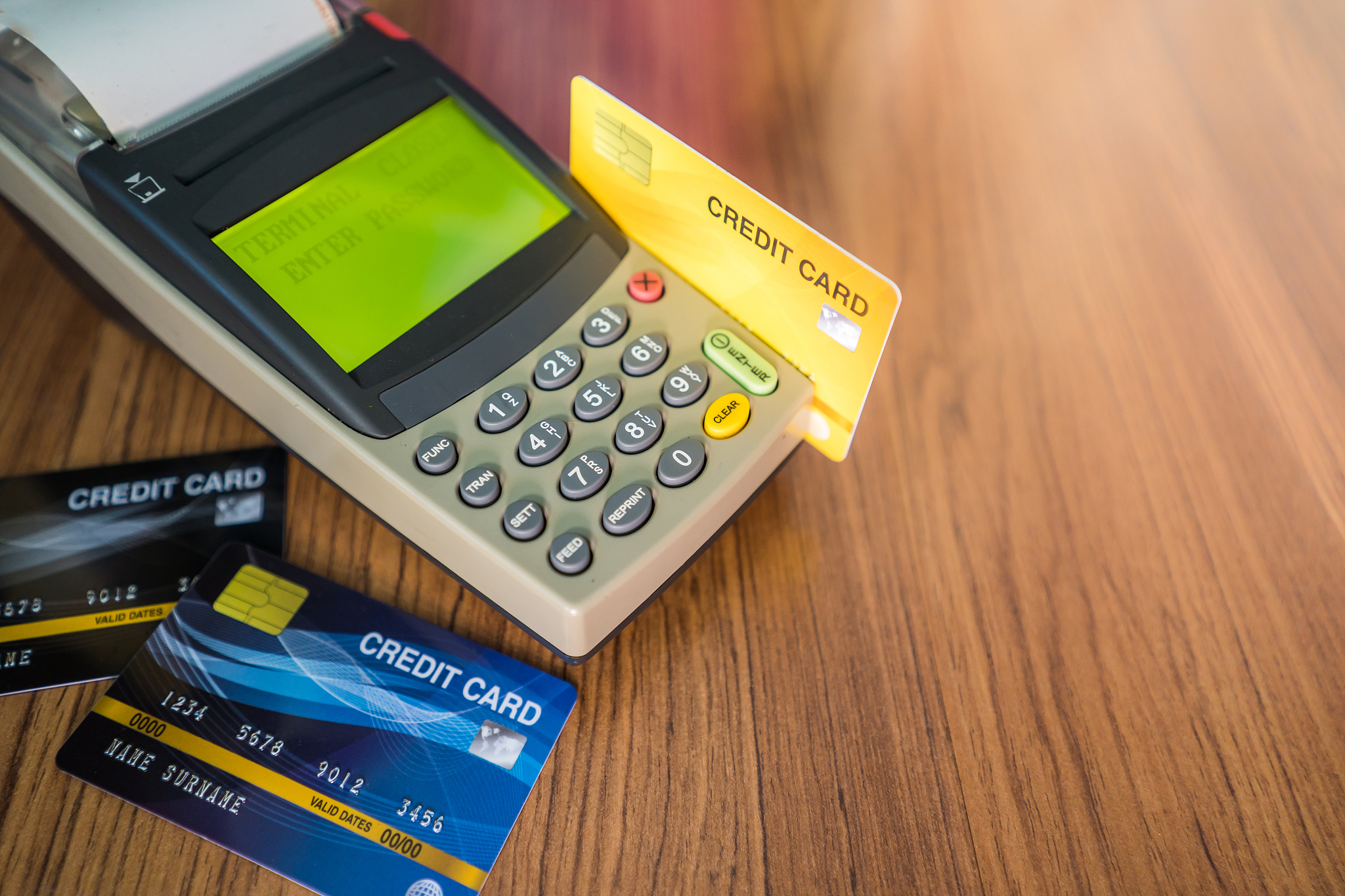many credit cards are used in the shop. shopping and retail conc