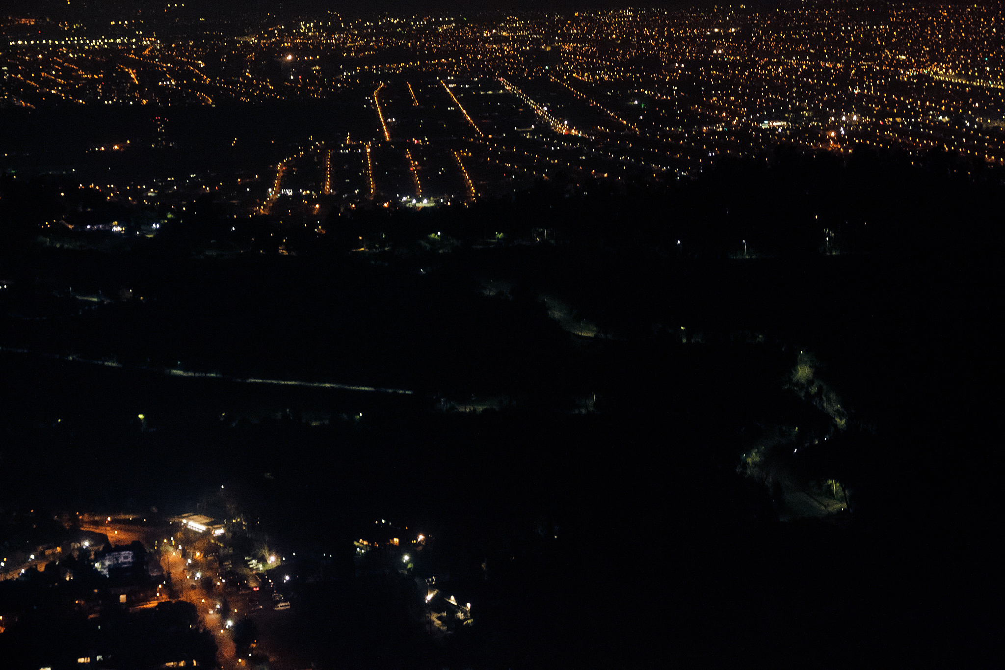 aerial view of illuminated cityscape at night