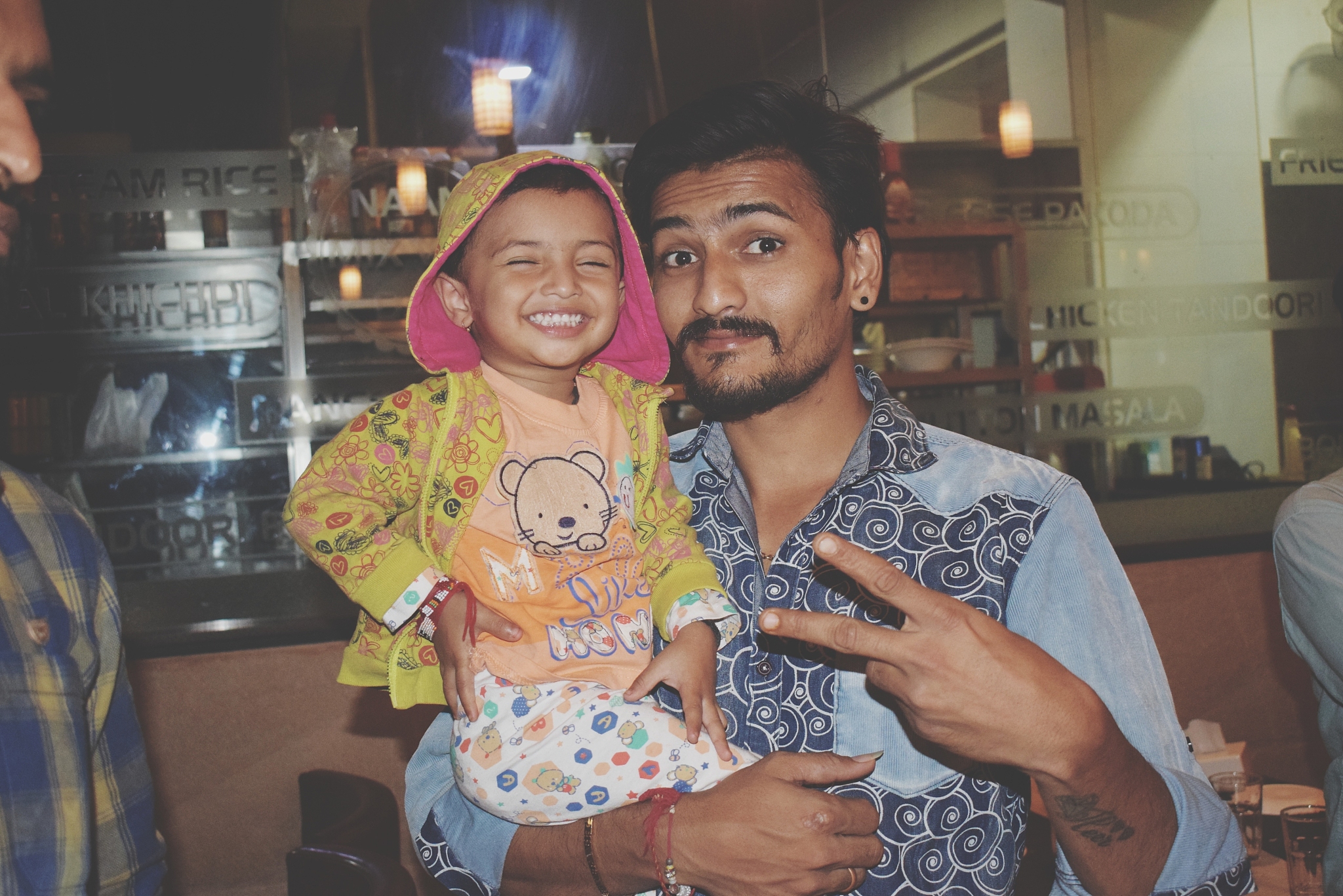 portrait of man carrying girl