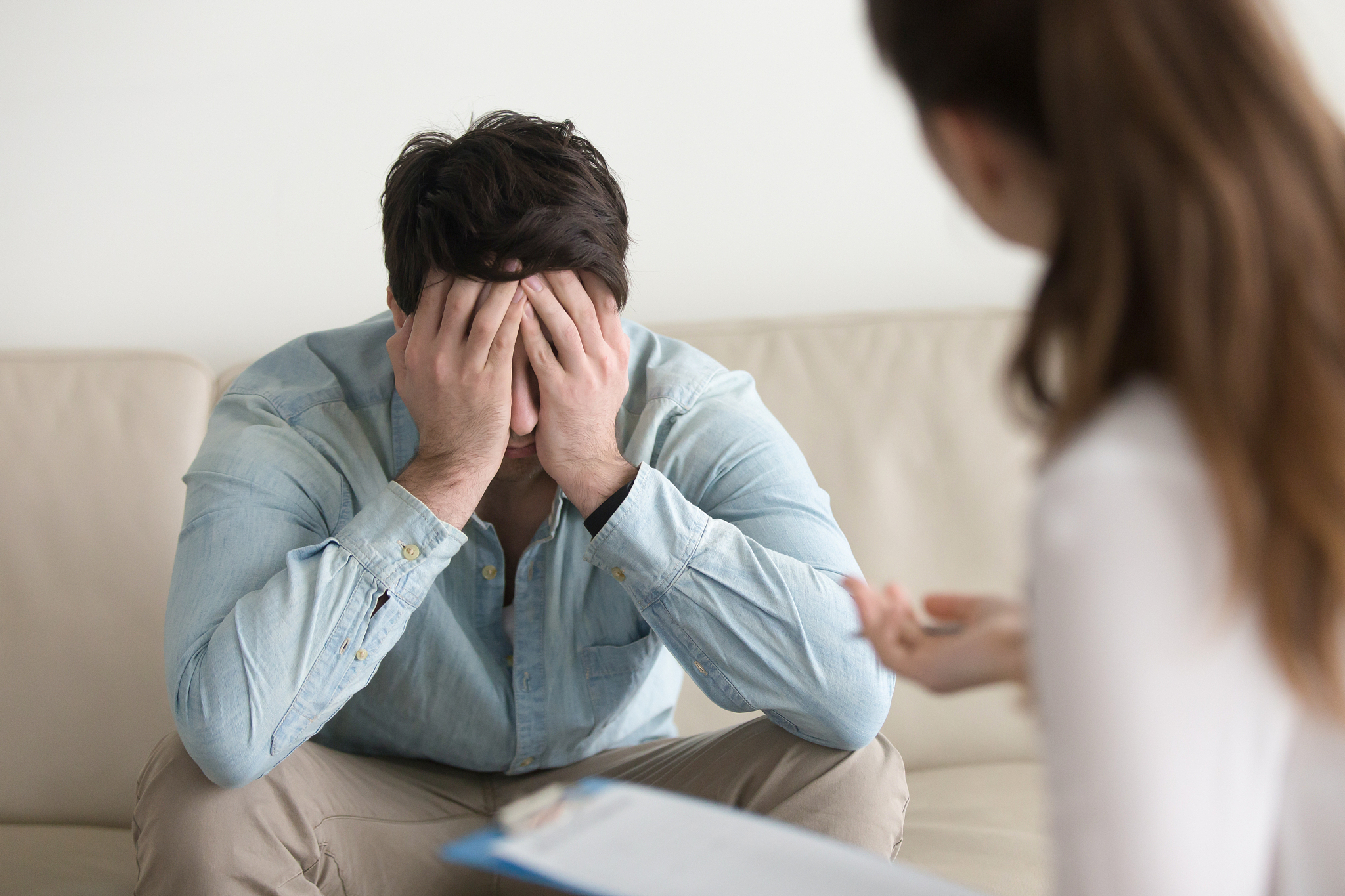 upset male patient feeling depressed, receiving bad news from do