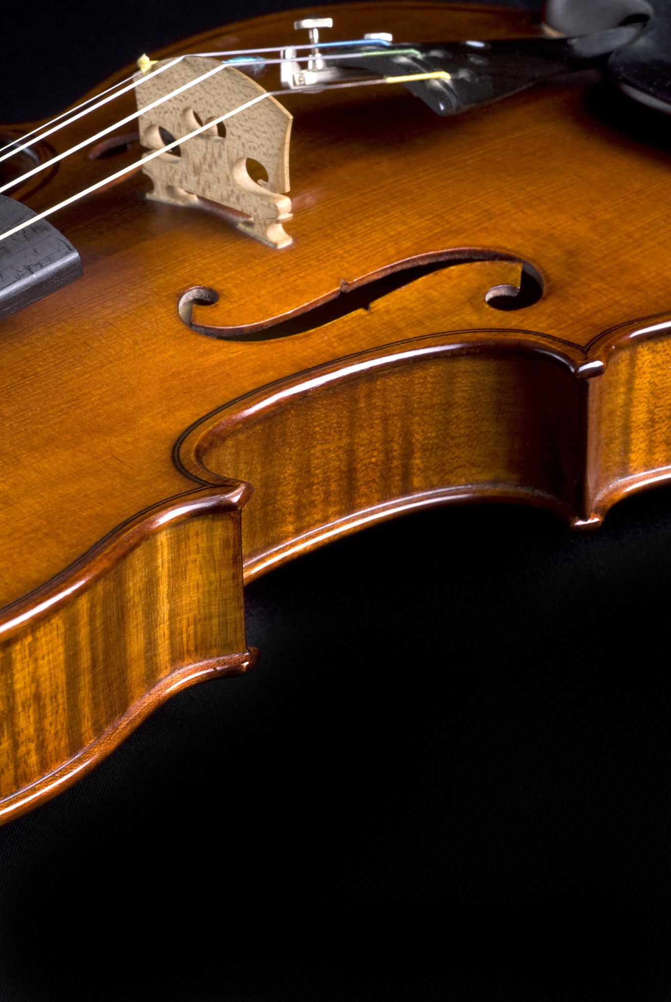 violin close up on black; room for copy (series)
