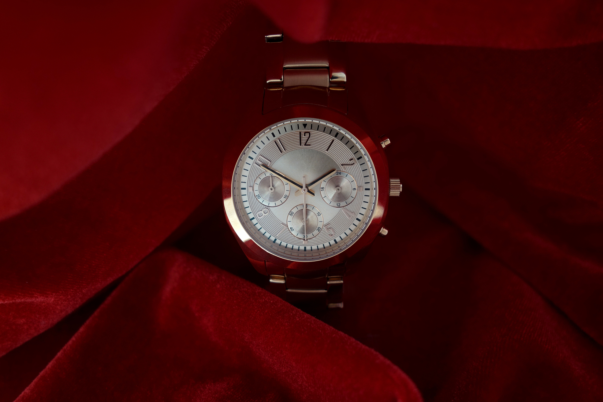 luxury ros?gold wrist watch on red velvet