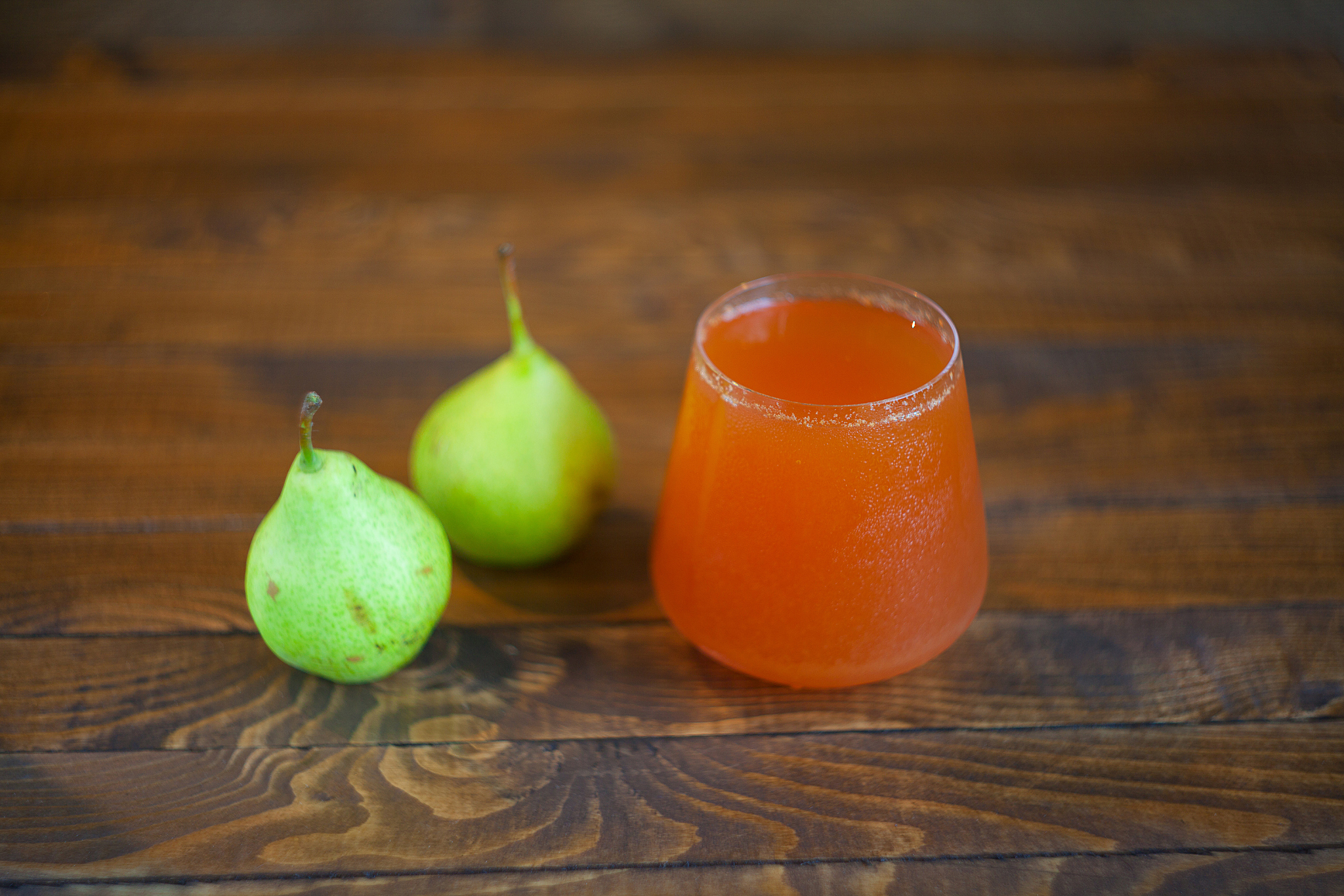 delicious fresh squeezed pear juice in  transparent glass