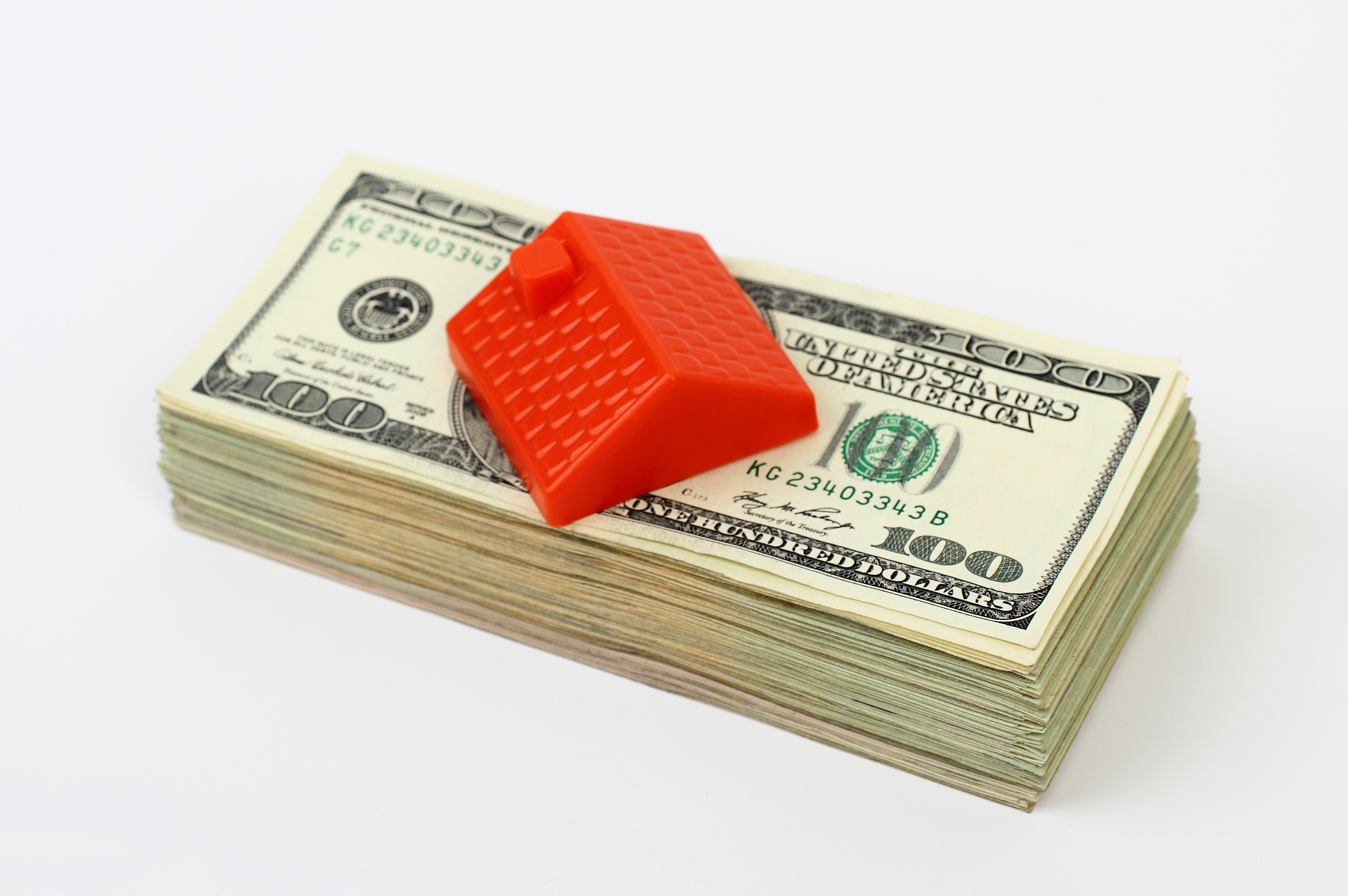 roof on the stack of dollars