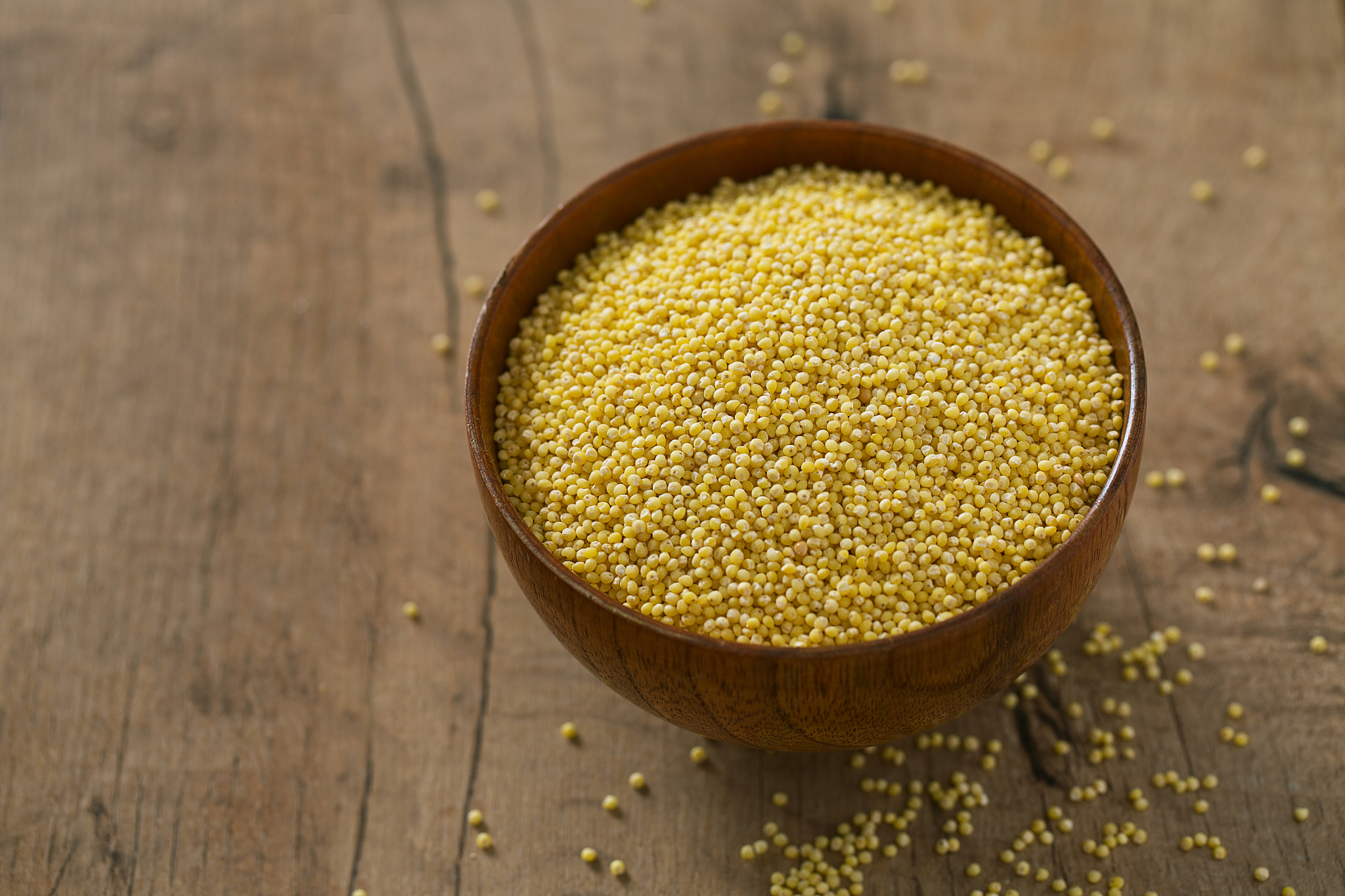 millet on wooden surface