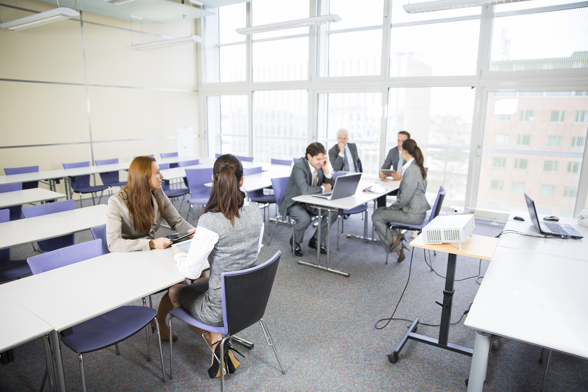 business people in education room talking about their problems