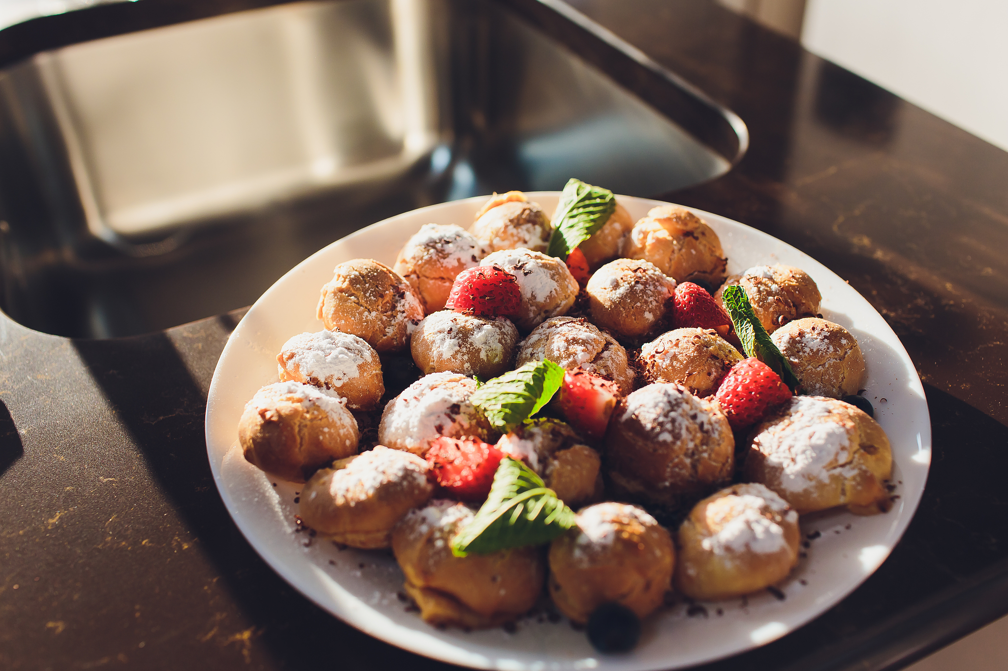 selection of decorative desserts on a buffet table at a catered 