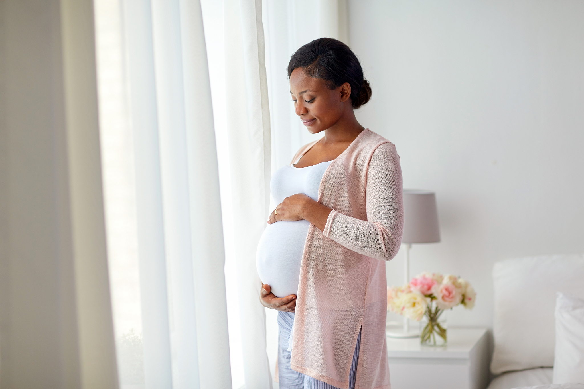 pregnancy, people and expectation concept - happy pregnant afric
