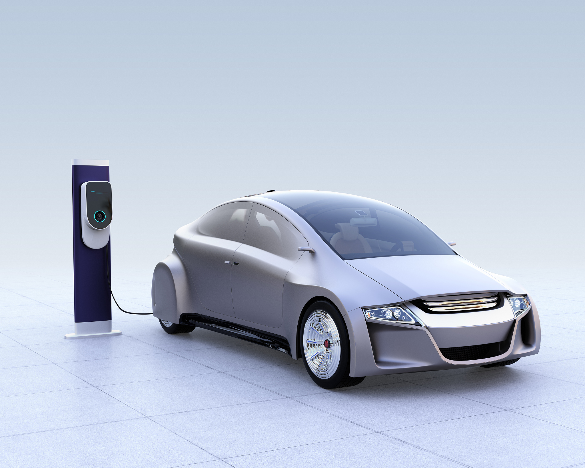 silver electric car and ev charging station