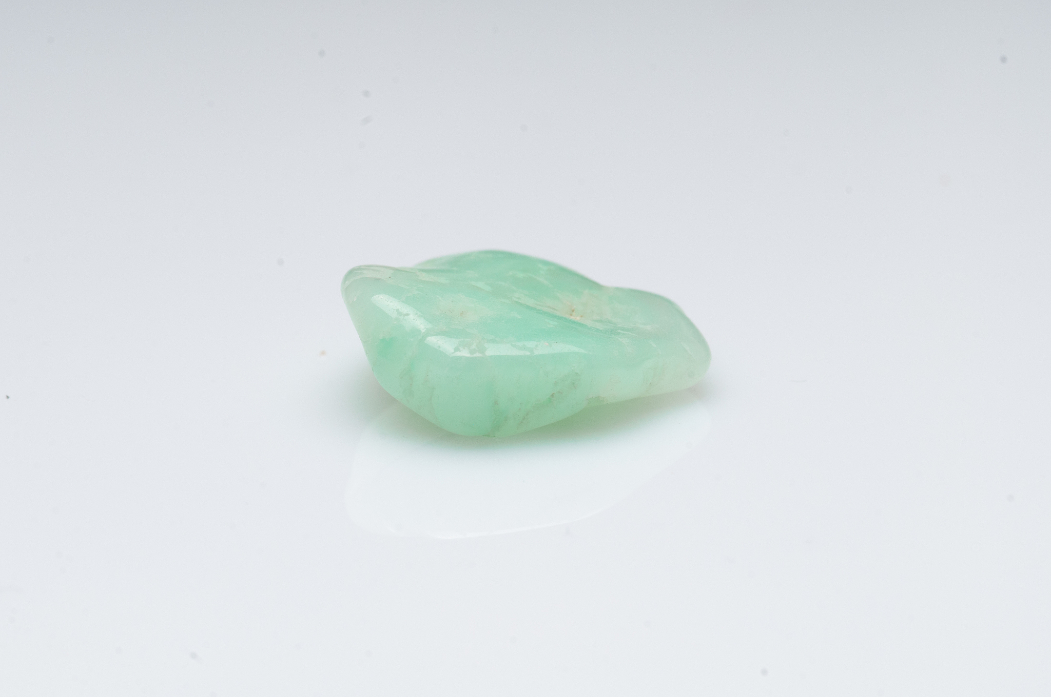 natural chrysoprase stone on white background