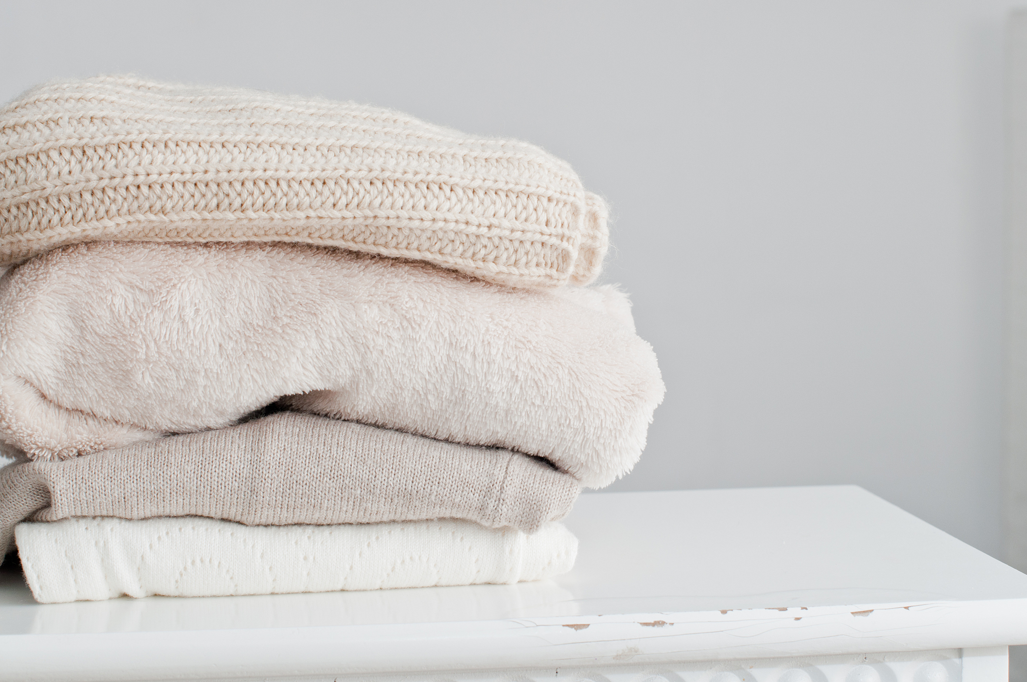 knitting clothes in basket