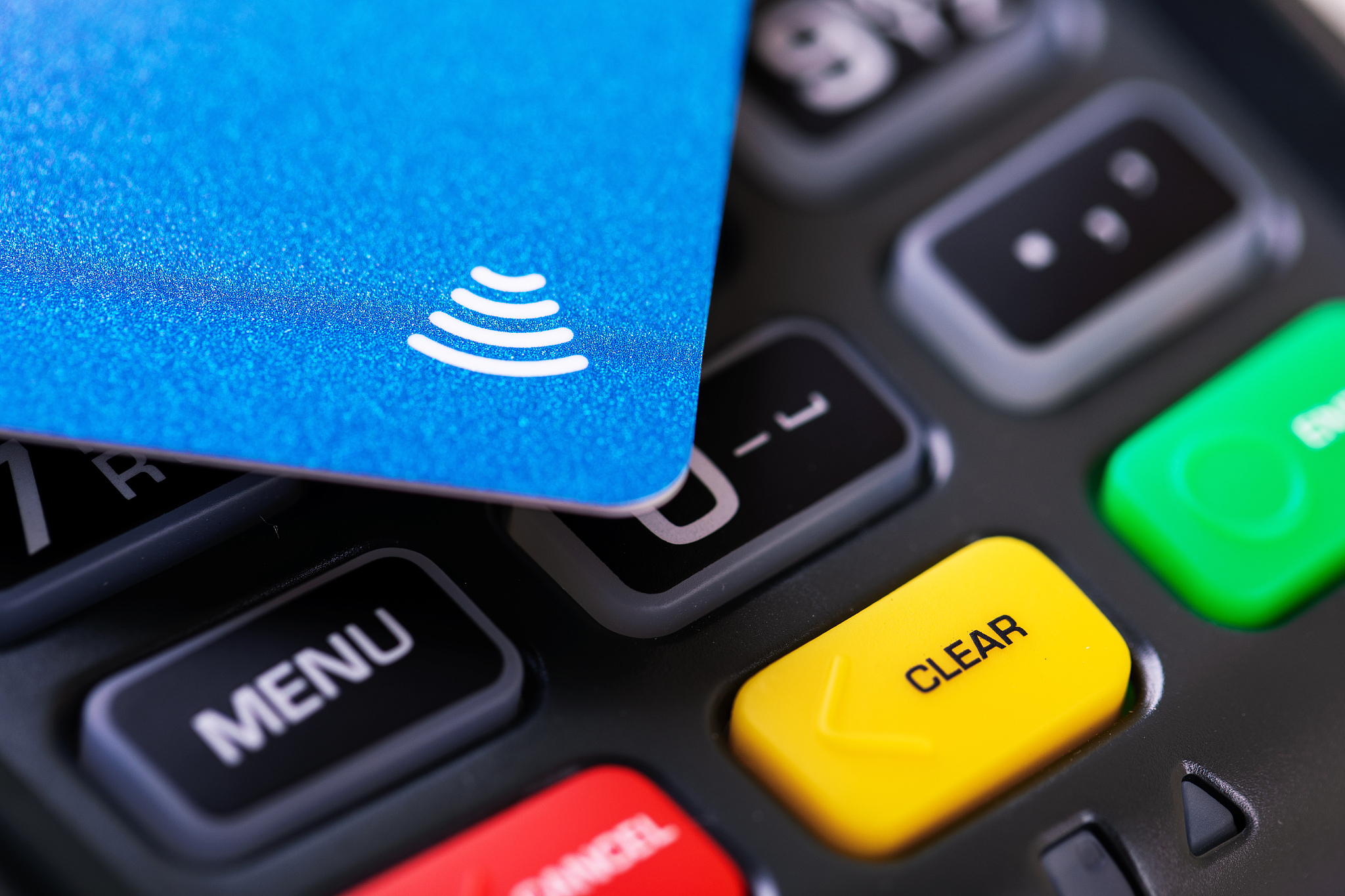 contactless payment - nfc credit card on transaction terminal