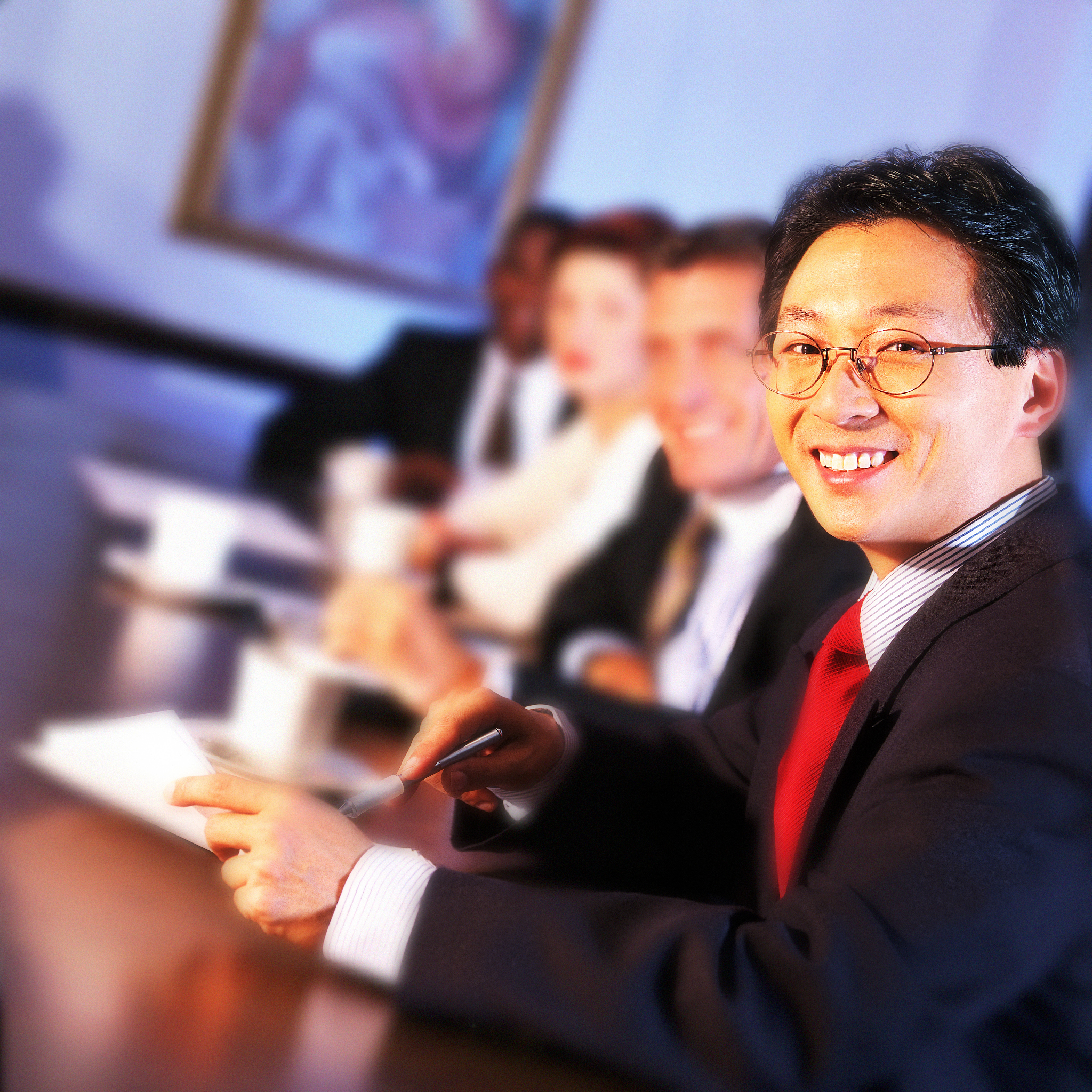 view of businessmen and businesswomen in a meeting