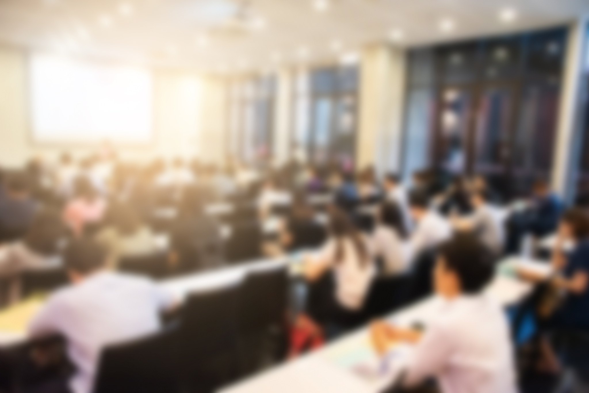 blurred background of business people in conference hall or semi
