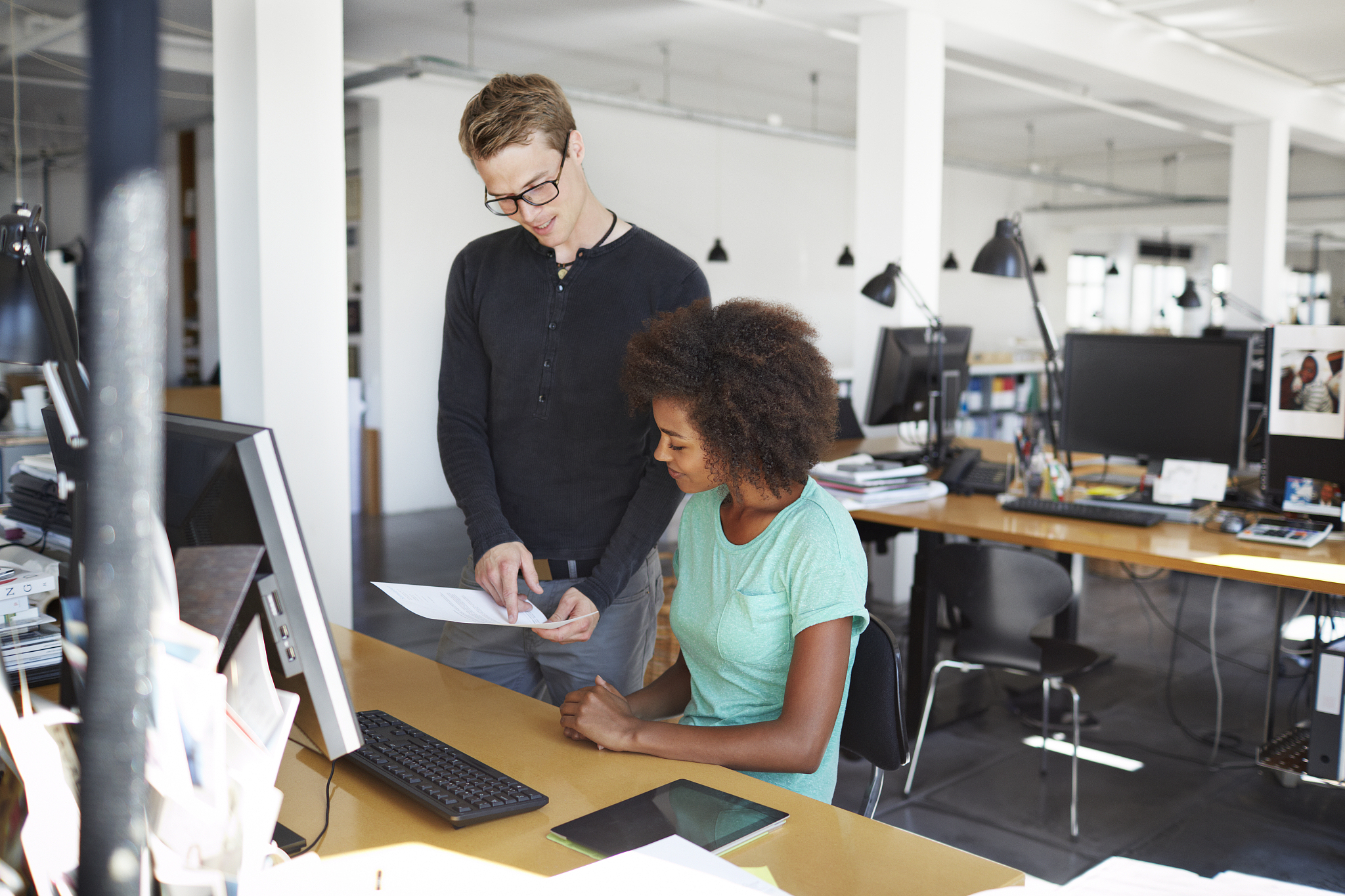 businessman and coworker at office desk