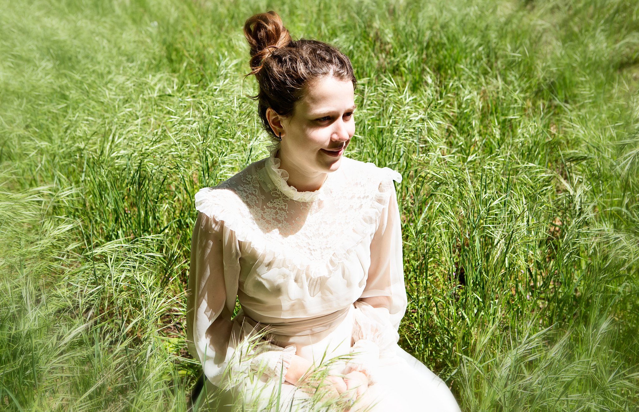 romantic soft-focus portrait of old-fashioned young woman smilin