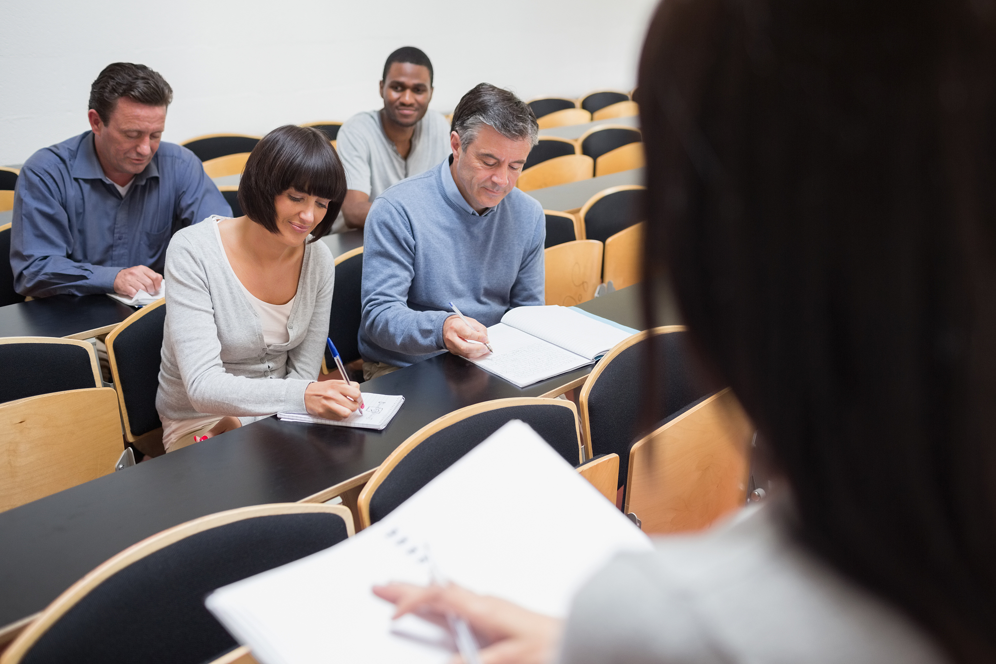 people taking notes in class