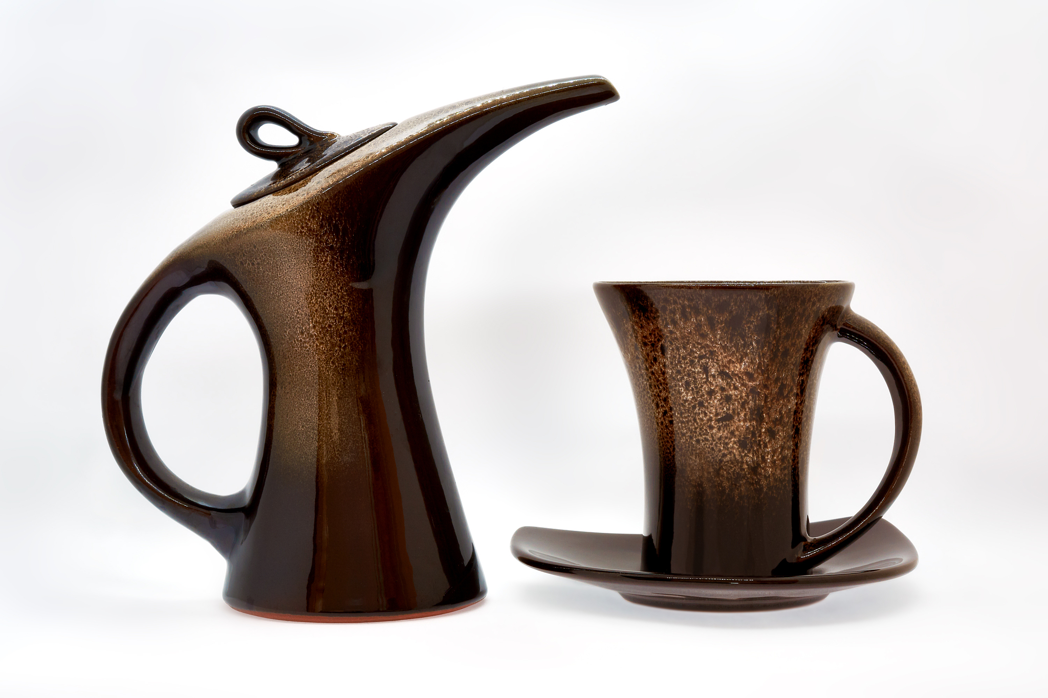 souvenir ceramic teapot and cup and saucer for coffee or tea on 