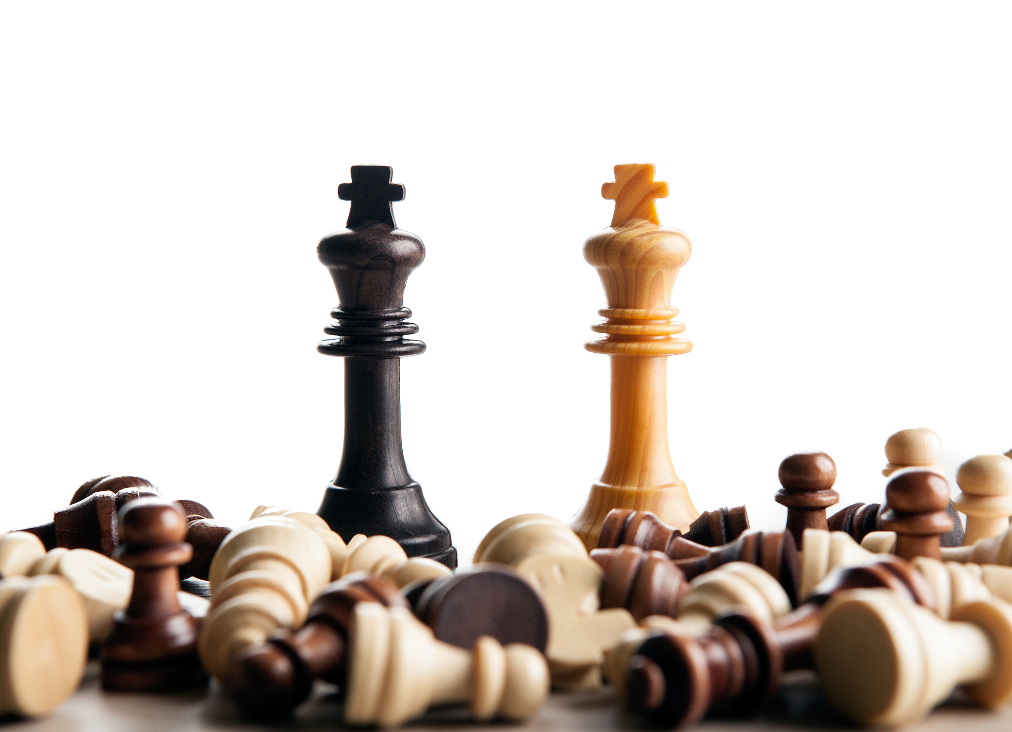 chess duel of two kings on a white background close up