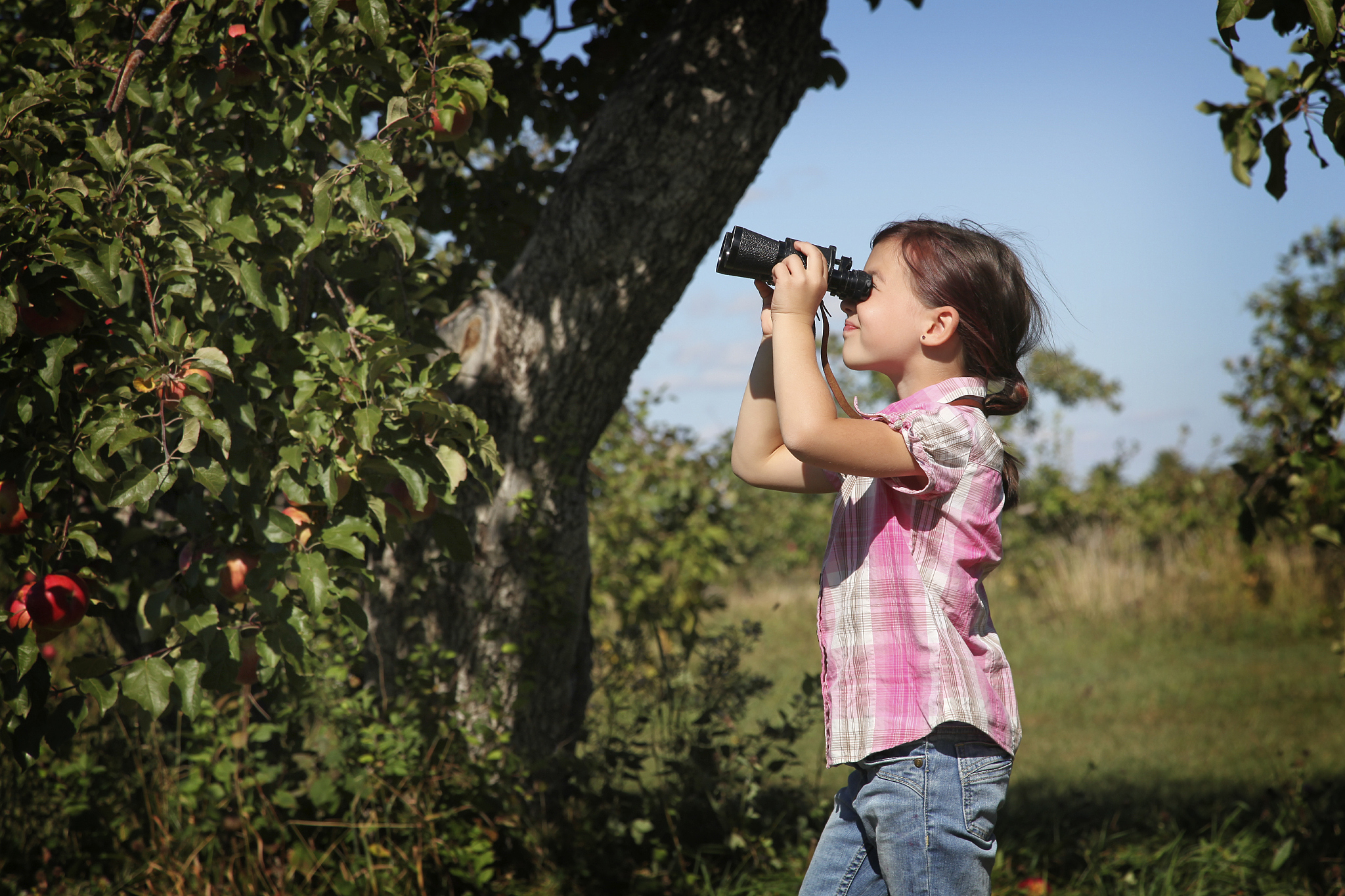young girl with binoculars