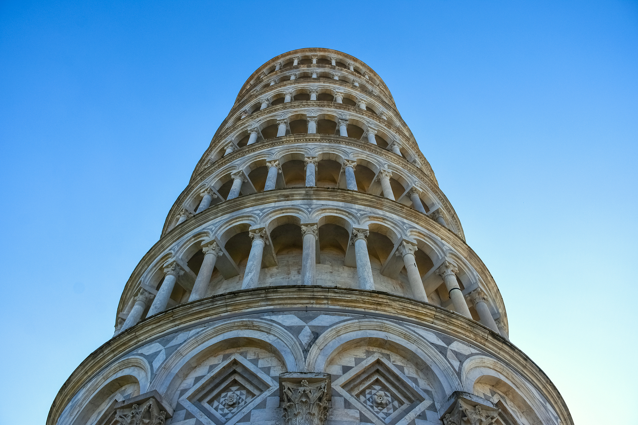 leaning tower of pisa seen from directly below in pisa, tuscany,