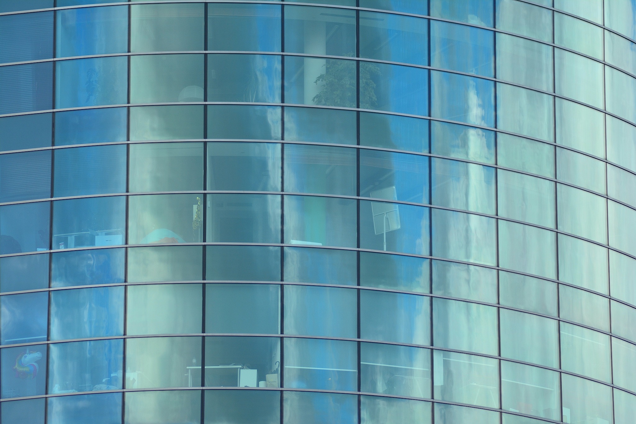 modern building with reflected sky and cloud in glass window