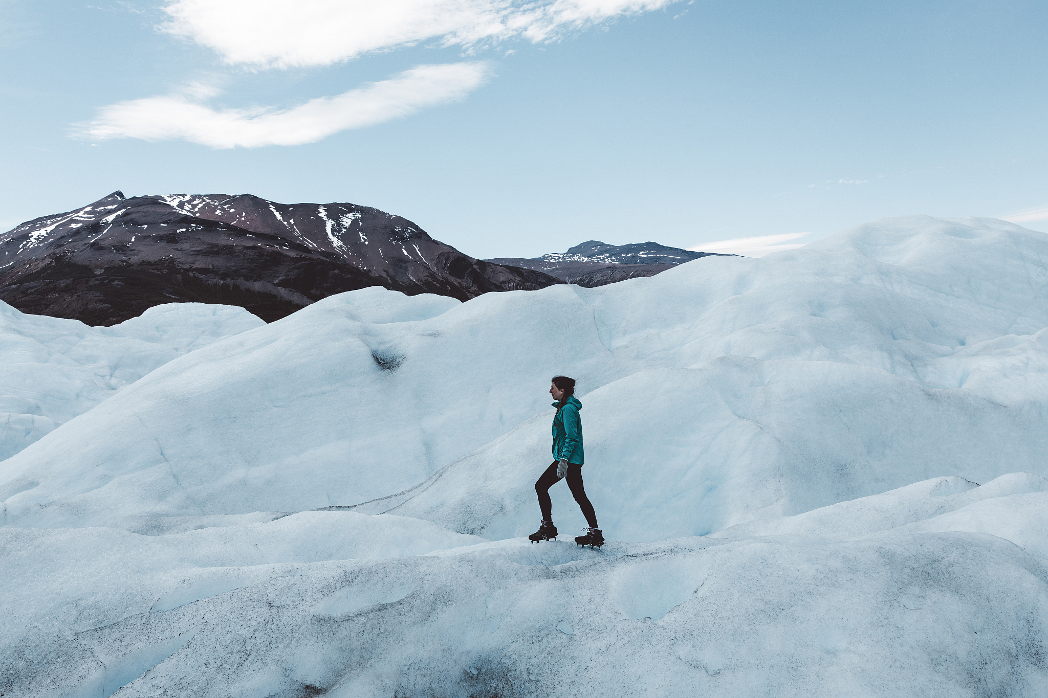 woman hiking on perito moreno glacier