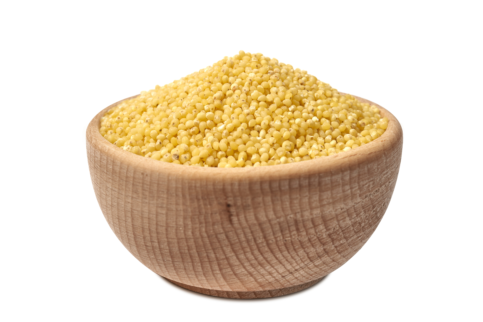 grains, groats, flakes in a wooden bowl