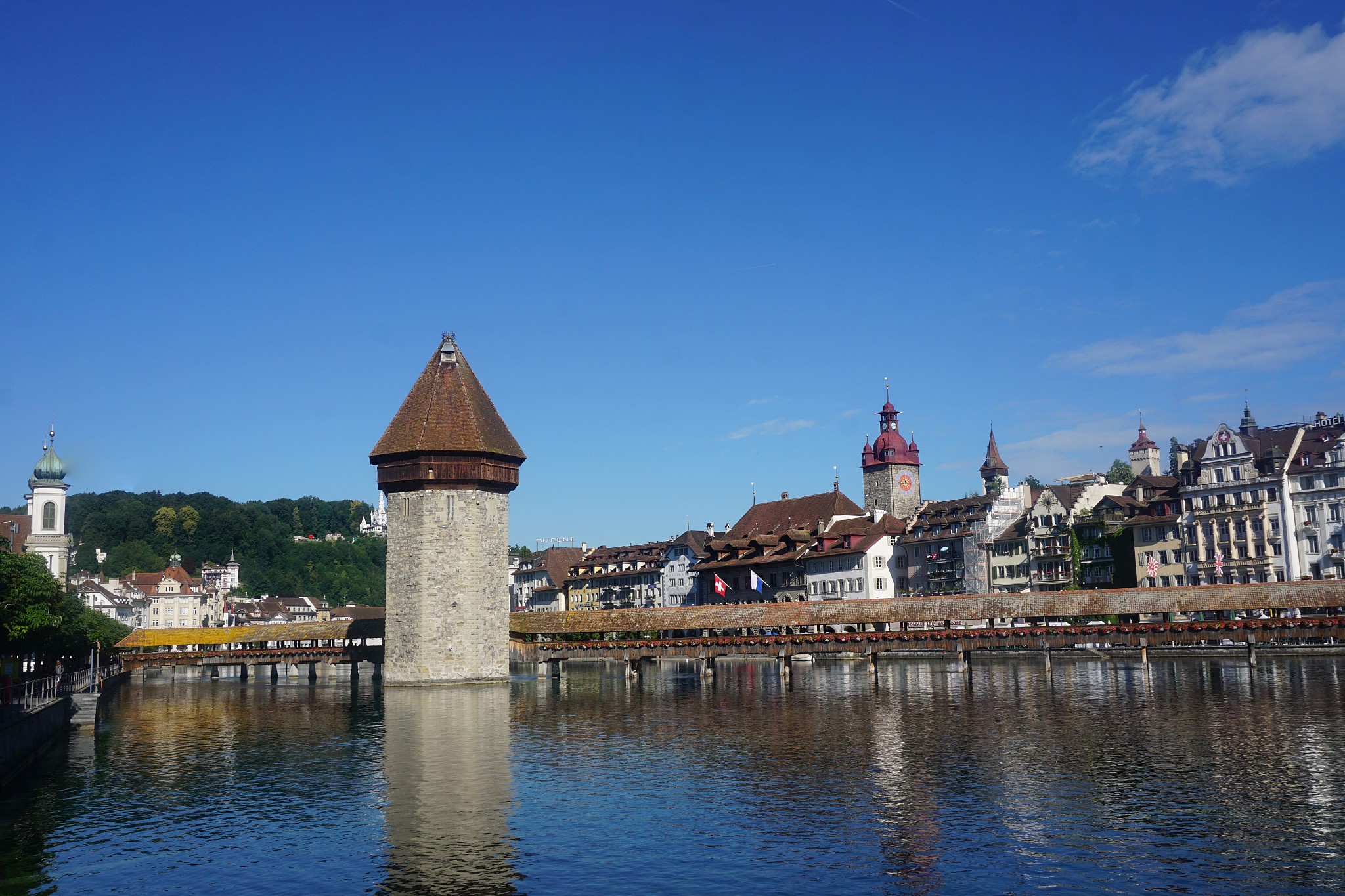 water tower in switzerland town at a lake