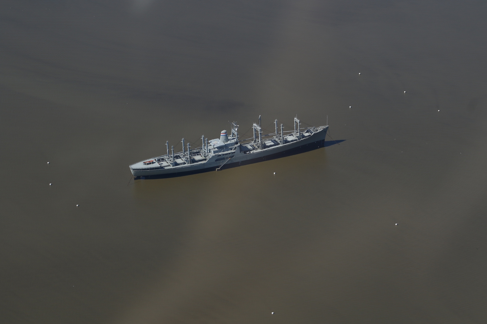 aerial view of old merchant marine vessels in a river