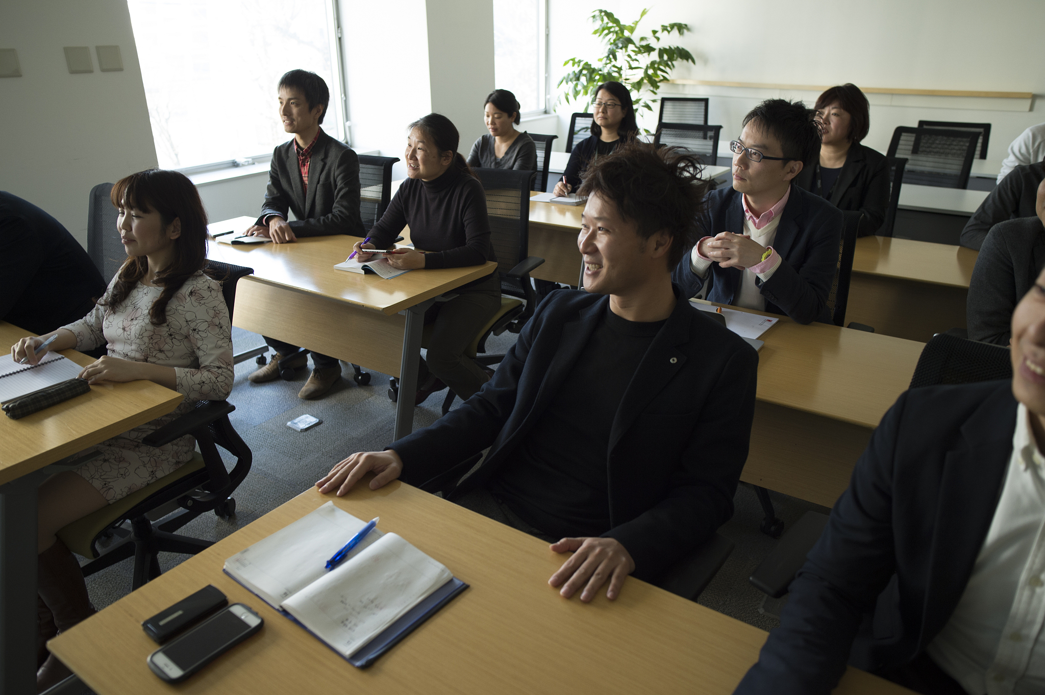 people watching presentation in conference room