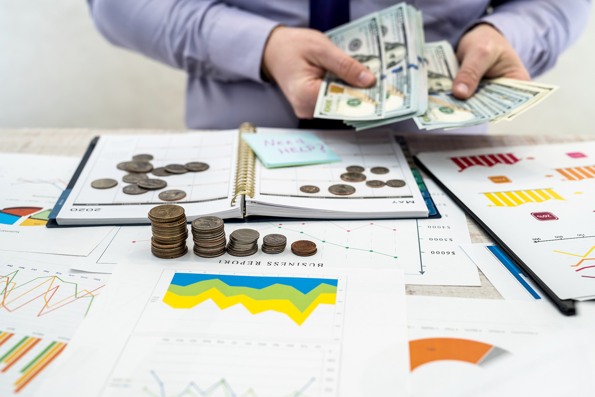 a man works and calculates company profits from the sale or leas