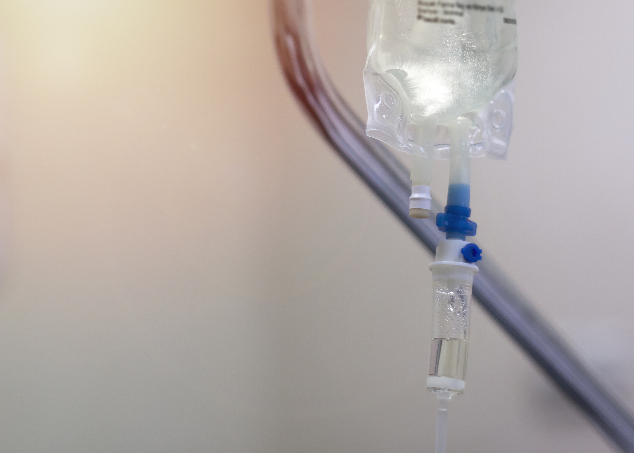 close up of iv drip in hospital room stock photo
